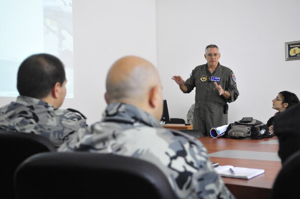 Lt. Col. Robert Lehman, 86th Medical Squadron flight surgeon, briefs medical professionals from the Bulgarian Air Force during a round-table discussion on the history and future of flight medicine, Oct. 19 at Graf Ignatievo Air Base, Bulgaria. Airmen from the 86th Airlift Wing and 435th Air Ground Operations Wing at Ramstein Air Base, Germany, joined Airmen from throughout U.S. Air Forces in Europe in Plovdiv, Bulgaria, for Thracian Fall 2010, an on-site training designed to building the partnership between the U.S. and Bulgarian Air Force. (U.S. Air Force photo by Tech. Sgt. Michael Voss) 

