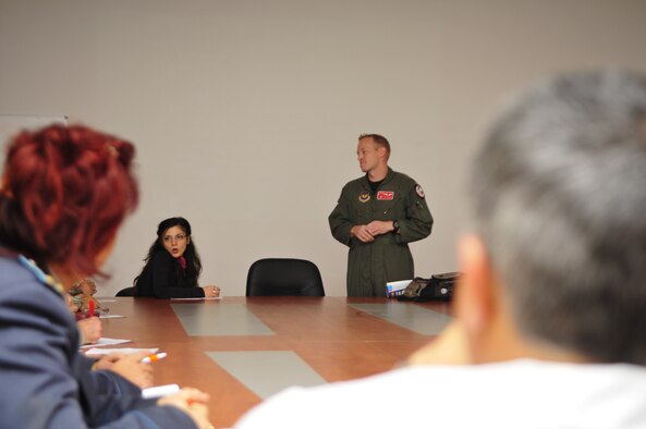 U.S. Air Force Maj. Ryan Freeland, 480th Fighter Squadron flight surgeon from Spangdahlem Air Base, Germany briefs his Bulgarian Air Force counterparts on flight medicine techniques used in the U.S. Air Force during a round-table discussion at Graf Ignatievo Air Base, Bulgaria, Oct. 19. Airmen from the 86th Airlift Wing and 435th Air Ground Operations Wing at Ramstein Air Base, Germany, joined Airmen from throughout U.S. Air Forces in Europe in Plovdiv, Bulgaria, for Thracian Fall 2010, an on-site training designed to build the partnership between the U.S. and Bulgarian Air Force. (U.S. Air Force photo by Tech. Sgt. Michael Voss) 
