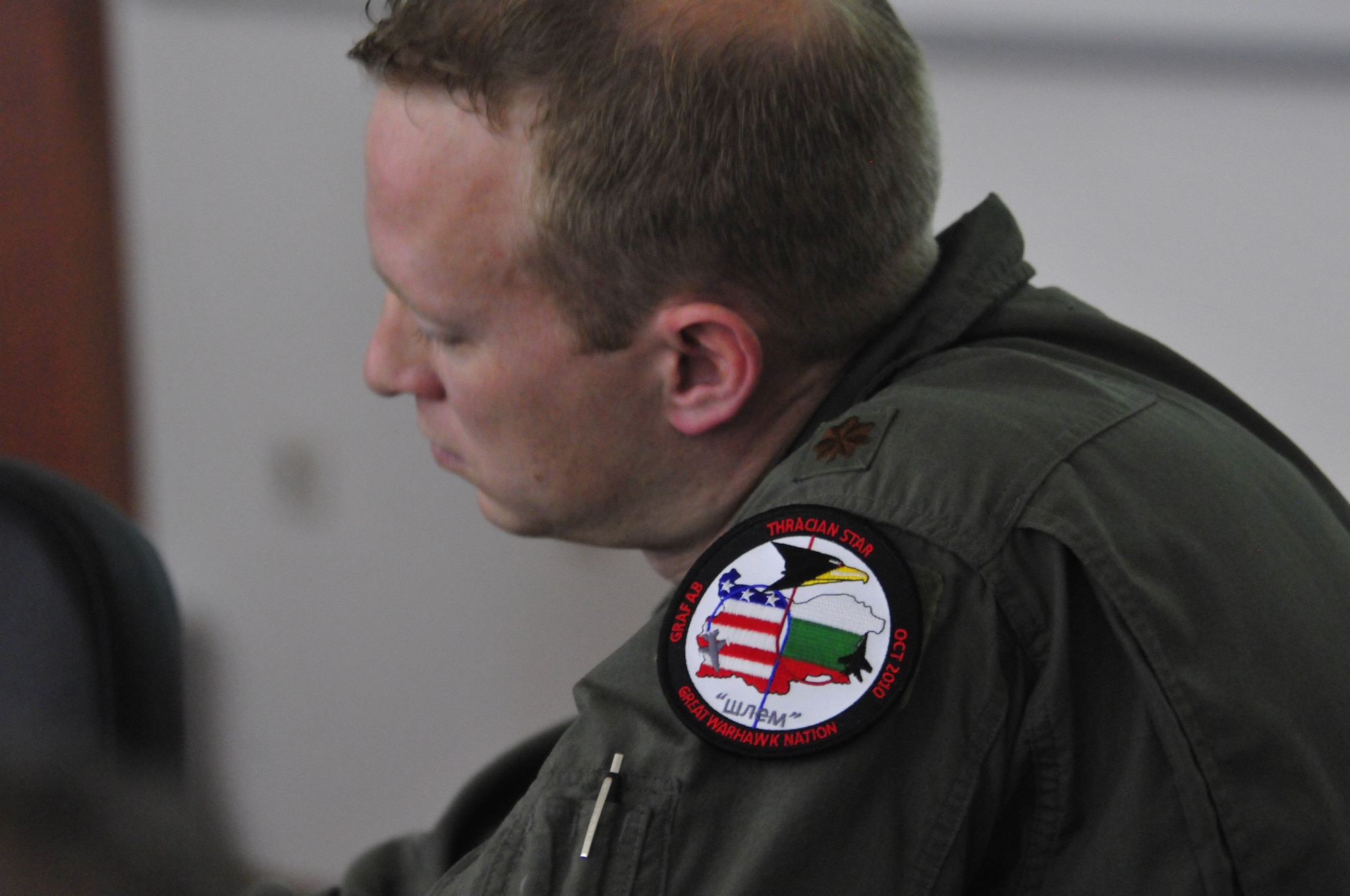 U.S. Air Force Maj. Ryan Freeland, 480th Fighter Squadron Flight Surgeon from Spangdahlem Air Base, Germany briefs his Bulgarian Air Force counterparts on flight medicine techniques used in the U.S. Air Force during a round-table discussion at Graf Ignatievo Air Base, Bulgaria, Oct. 19.  Airmen from the 86th Airlift Wing and 435th Air Ground Operations Wing at Ramstein Air Base, Germany joined airmen from throughout U.S. Air Forces in Europe in Plovdiv, Bulgaria, for Thracian Fall 2010, a week of on-site training designed to building the partnership between the U.S. and Bulgarian Air Force. (U.S. Air Force photo by Tech. Sgt. Michael Voss)