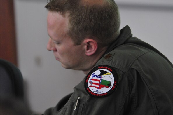 U.S. Air Force Maj. Ryan Freeland, 480th Fighter Squadron flight surgeon from Spangdahlem Air Base, Germany, briefs his Bulgarian Air Force counterparts on flight medicine techniques used in the U.S. Air Force during a round-table discussion at Graf Ignatievo Air Base, Bulgaria, Oct. 19. Airmen from the 86th Airlift Wing and 435th Air Ground Operations Wing at Ramstein Air Base, Germany, joined Airmen from throughout U.S. Air Forces in Europe in Plovdiv, Bulgaria, for Thracian Fall 2010, an on-site training designed to build the partnership between the U.S. and Bulgarian Air Force. (U.S. Air Force photo by Tech. Sgt. Michael Voss) 
