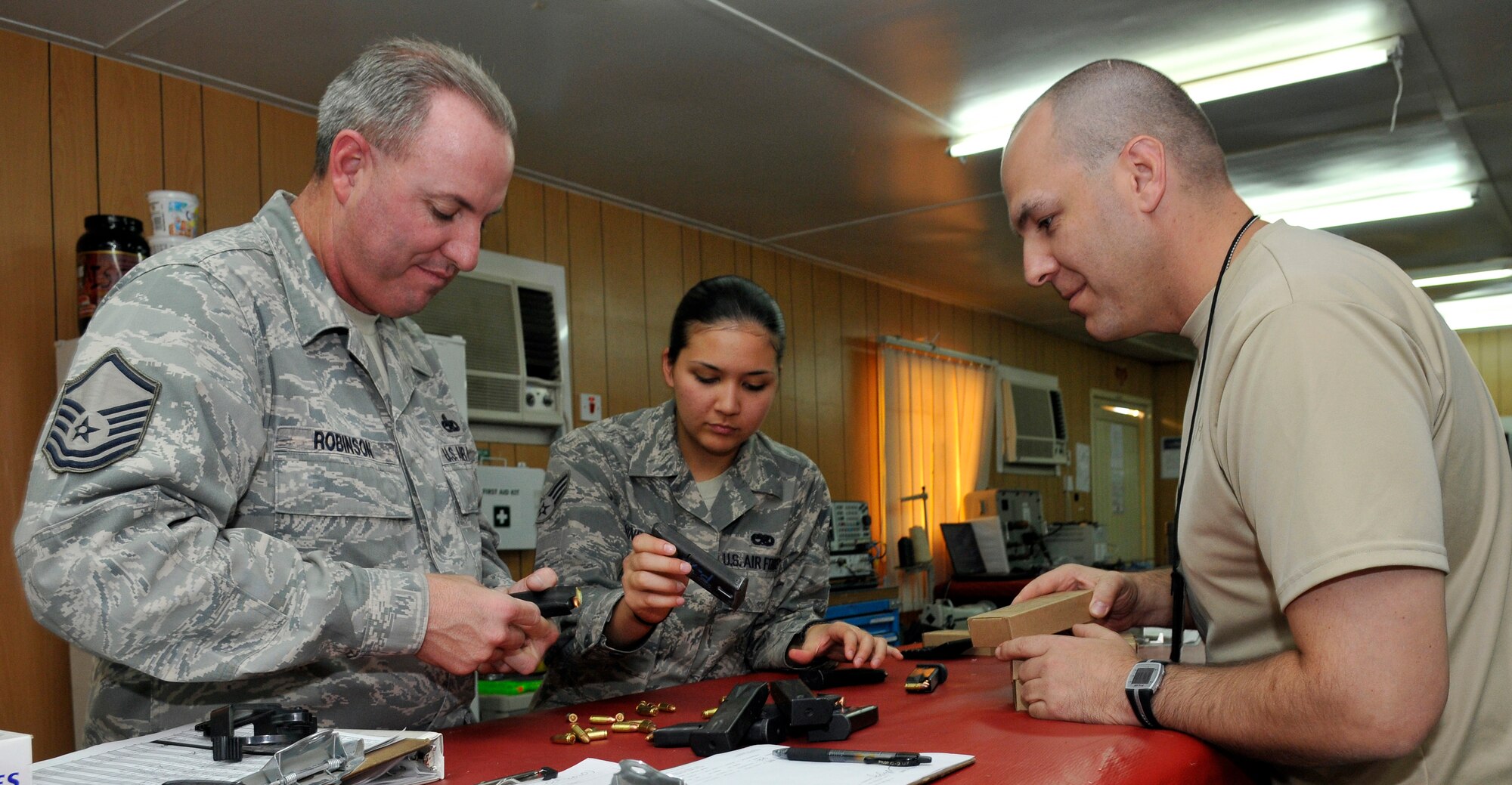 (Left to Right)Master Sgt. Stephen Robinson, 332nd Expeditionary Maintenance Squadron munitions accountable systems officer, Senior Airman Seprina Windrows, 332 EMXS custody account manager, and Tech. Sgt. Michael Gall, 13th Expeditionary Fighter Squadron aircrew flight equipment technician; count 9mm pistol ammunition during a MASO inventory inspection Oct. 13, 2010, Joint Base Balad, Iraq. The Airmen of the 332 EMXS Material Section’s Accountability Office inventories 10 percent of more than 40 munitions accounts every month, and 100 percent of accounts every six months, or whenever a munitions accountable systems officer changes out. The accountability office is also responsible for ordering more ammunition when individual account supplies get low.

“Without the accountability office section JBB wouldn’t have the munitions to accomplish the mission,” said Chief Master Sgt. Erick Hays, 332 EMXS Munitions Flight chief, a native of Kingsley, Mich., deployed from Camp Darby, Italy. Sergeant Robinson is a native of Denton, Texas, deployed from Nellis Air Force Base, Nev. Airman Windrows is a native of Coleen, Texas, deployed from Spangdahlem, Germany. Sergeant Gall is a native of Aurora, Neb., deployed from Misawa Air Base, Japan. (U.S. Air Force photo/Tech. Sgt. Phillip Butterfield)
