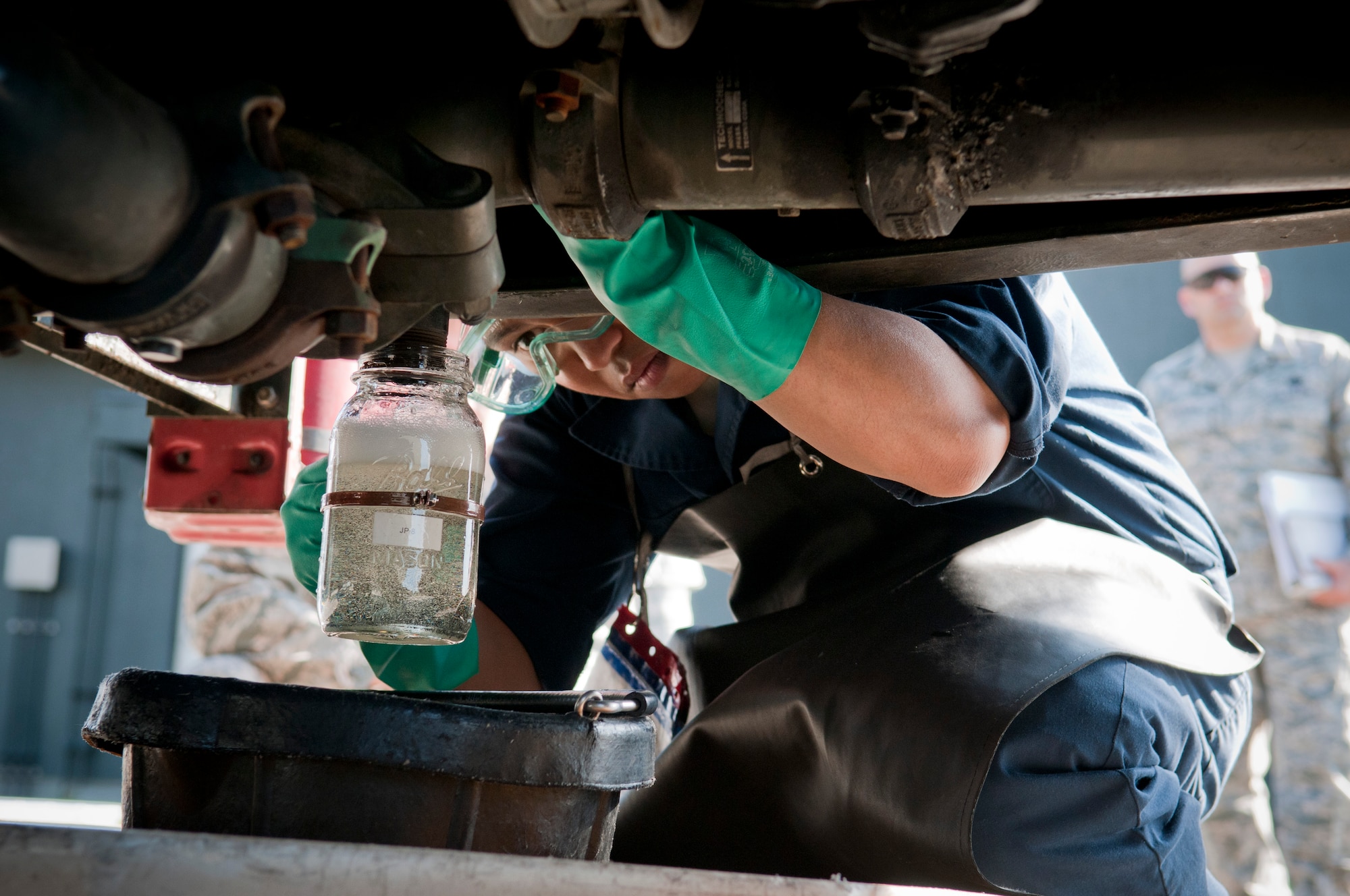 Airman 1st Class Richard Leomo, 35th Logistic Readiness Squadron refueling maintenance technician, drains fuel from a refueling truck at Misawa Air Base, Japan, Oct. 19, 2010, during a Logistics Compliance Assessment Program inspection. An LCAP inspector from Air Combat Command observed a four-man team while conducting their its fuel truck inspection. (U.S. Air Force photo by Senior Airman Jessica Lockoski/Released) 