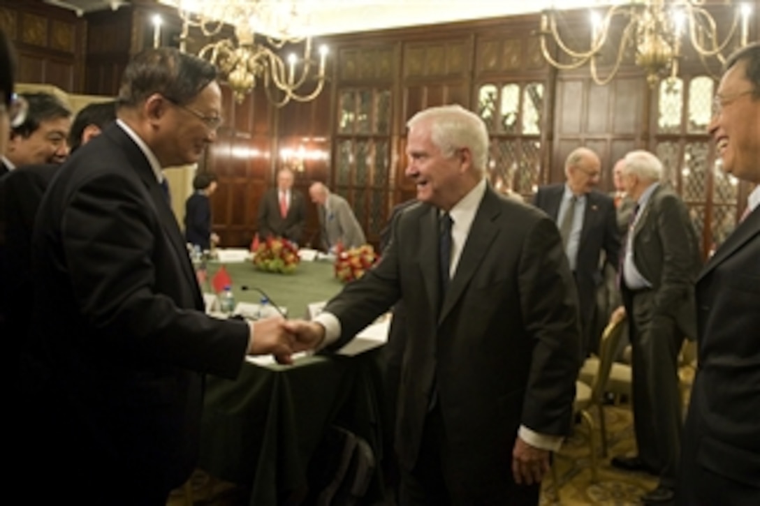 Secretary of Defense Robert M. Gates shakes hands with Former State Councilor for the People's Republic of China Tang Jiaxuan during the U.S. and China Track Two Discussions in Washington, D.C., on Oct. 18, 2010.  