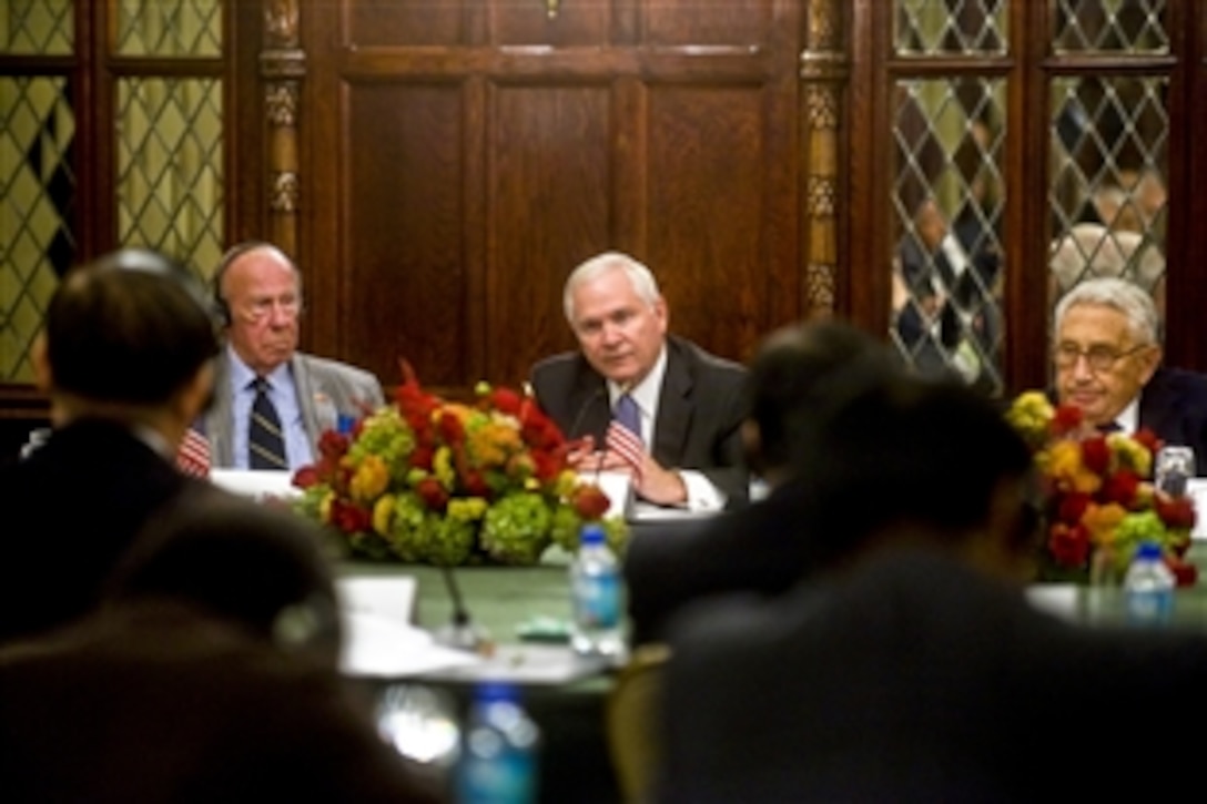 U.S. Defense Secretary Robert M. Gates, center, participates in the U.S. and China Track Two discussions with former Secretary of State Henry Kissinger, right, former Secretary of State George Shultz, left, and former State Councilor for the People's Republic of China Tang Jiaxuan in Washington, D.C., Oct. 18, 2010.  
