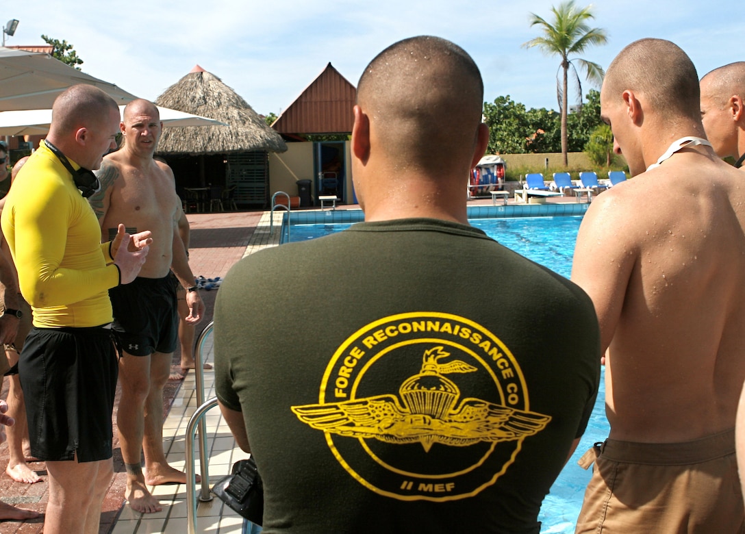 Marines from 2nd Platoon, Force Reconnaissance Company, II Marine Expeditionary Force, receive instruction from a Marine combat instructor of water survival aboard Royal Netherlands Marine Corps Base Camp Suffisant, Curacao, Oct. 19, 2010. The training focused not only on pushing the Marines physically, but also on improving confidence in their abilities.
