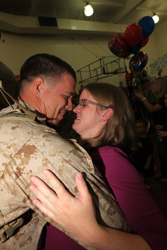 Cpl. Creg Varner, a rifleman, hugs his sister, Trisha, Oct. 20, 2010, at Del Valle softball field upon 3rd Battalion 7th Marines return from their deployment to Helmand province, Afghanistan.::r::::n::