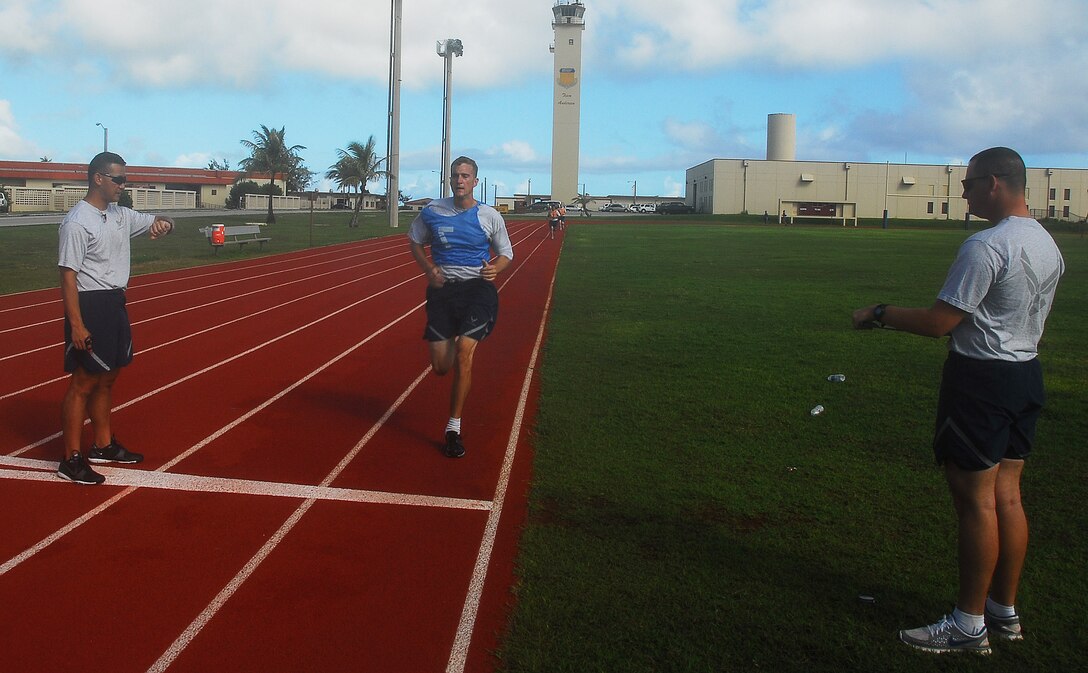Tech. Sgt. Kyle Rieger finishes his 1.5 mile run during his physical fitness test on Andersen Air Force Base, Oct. 18, 2010.  With the new standards, the run time now accounts for potentially 60% of an Airman's total fitness assessment score.  Sergeant Rieger is deployed here with the 36th Expeditionary Air Maintenance Squadron.  (U.S. Air Force photo/Staff Sgt. Jamie Powell)  