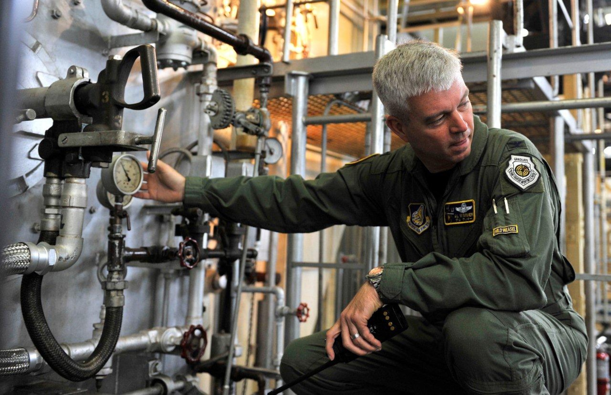 Colonel Al Wimmer, 35 Fighter Wing Vice Wing Commander, learns about the steam plant at Misawa Air Base Oct. 20, 2010. The heating system was activated, signaling an end to warm temperatures. Misawa residents are being asked to conserve energy as winter approaches. (U.S. Air Force photo by Staff Sgt. Chad Strohmeyer/Released) 