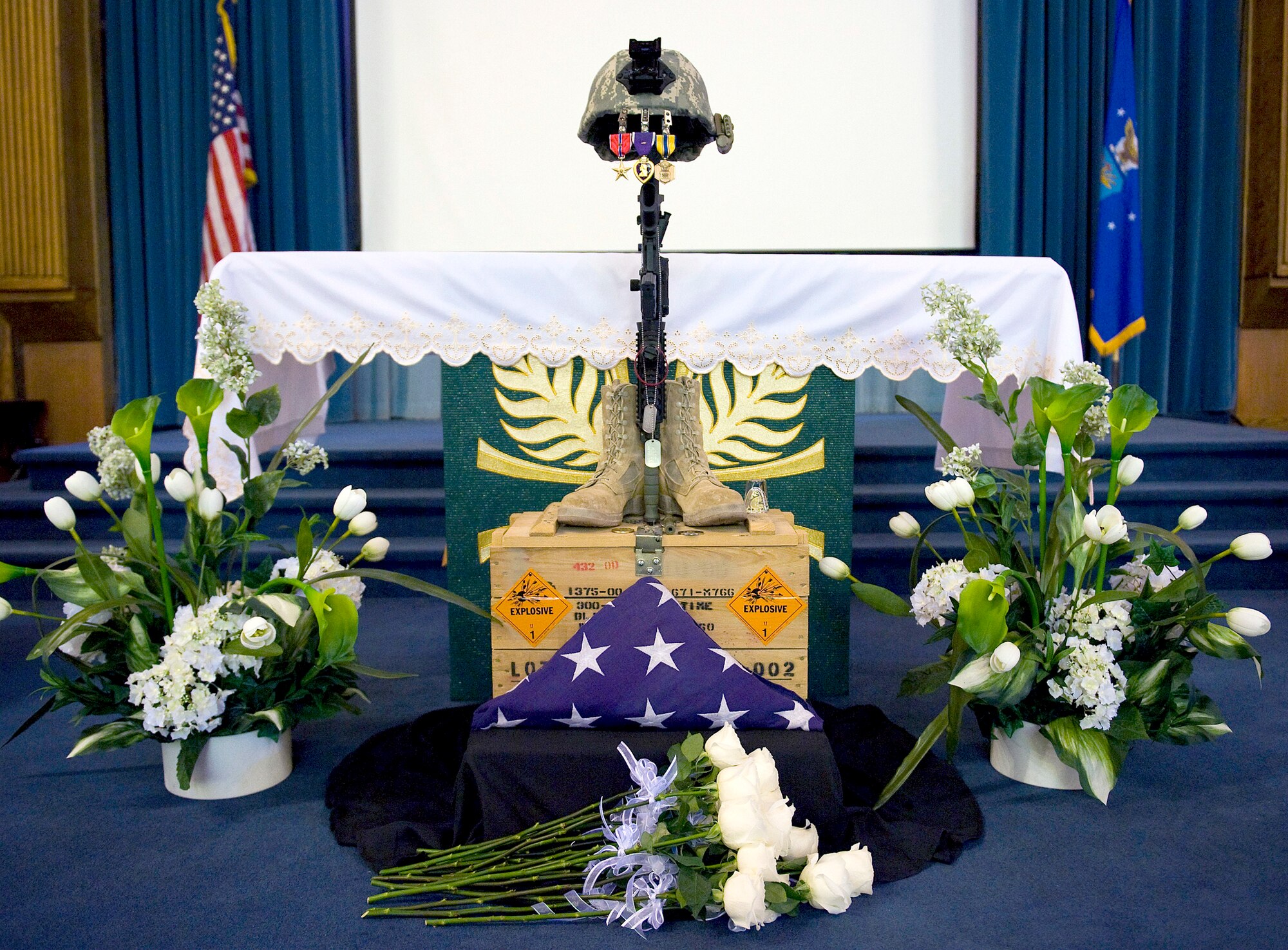 Hundreds of people gathered at the base chapel for a memorial service for Senior Airman Michael Buras Oct. 15, 2010, at Nellis Air Force Base, Nev. Airman Buras was an explosive ordnance disposal journeyman assigned to the 99th Civil Engineer Squadron when he was killed in action while responding to a roadside bomb Sept. 21, 2010, in Afghanistan. (U.S. Air Force photo/Senior Airman Brett Clashman)