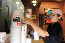 MINOT AIR FORCE BASE, N.D. -- Eugenia Bennett, wife of Staff Sgt. Anthony Bennett, 5th Contracting Squadron noncommissioned officer in charge mission support flight, organizes the cups at the Power Blendz smoothie bar located in the McAdoo Sports and Fitness Center here Oct. 14. The Power Blendz smoothie bar, which opened Sept. 27, makes meal replacement smoothies with additional supplements added as well as regular fruit smoothies. (U.S. Air Force photo by Airman 1st Class Aaron-Forrest Wainwright)