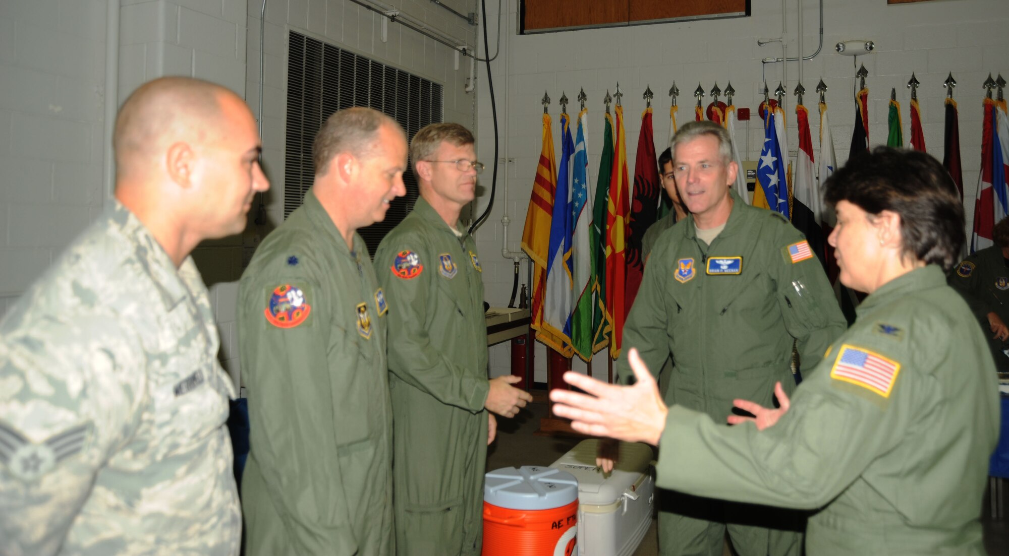 Col. Martie Soper, Commander of the 440th Formal Training Unit, explains to Maj. Gen. Meenan that the facility where the training unit is located was a storage warehouse less than three months before the Oct. 19, 2010 opening. Colonel Stoper credits the work to the volunteers from the 95th Airlift Squadron. Listed in the picture with General Meenan and Colonel Soper  is (left to right), Senior Airman Joe Merrifield, Loadmaster, Lt. Col. Bret Larson, 95th Airlift Squadron commander, Chief Master Sgt. Steve Koetter, Loadmaster Supervisor. (U.S. Air Force photo by Jerry Green)