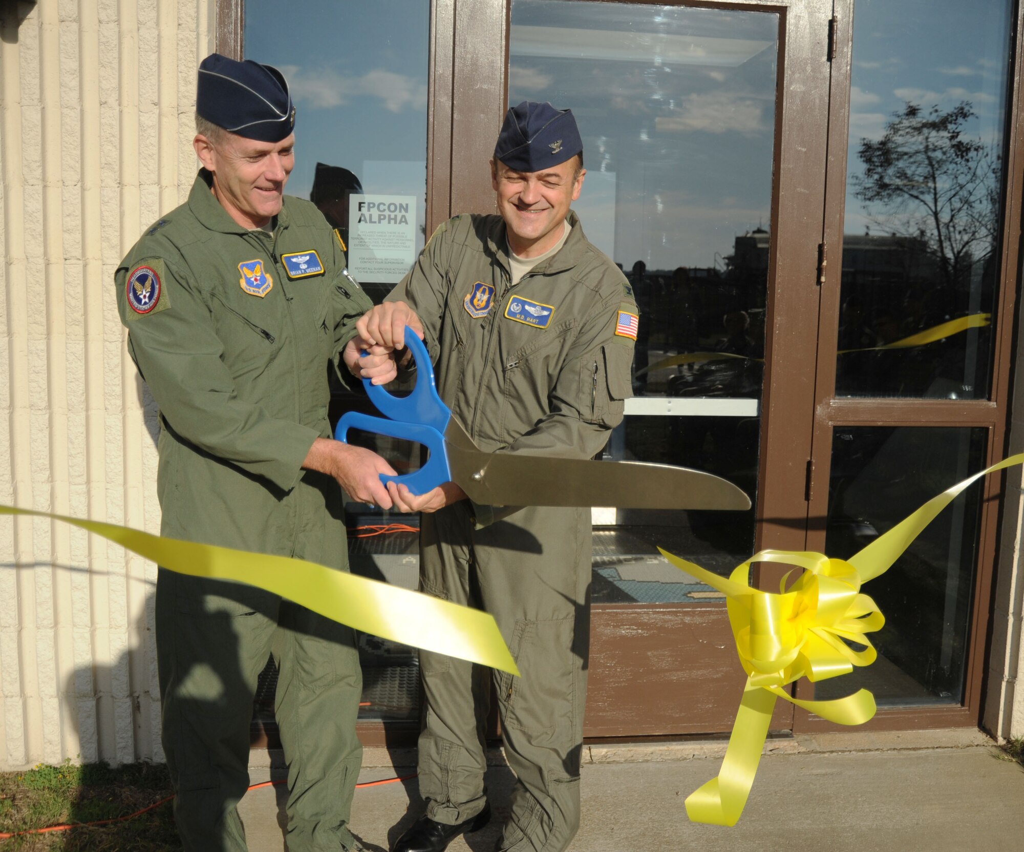 On October 19, 2010, Maj. Gen. Brian Meenan and Col. Merle "Mad Dog" Hart cut the ribbon signifying the opening of the Formal Training Unit. A detachment of the 440th Operations Group at Pope Field, the FTU is an innovative training program for aeromedical crew training. (U.S. Air Force photo by Jerry Green)