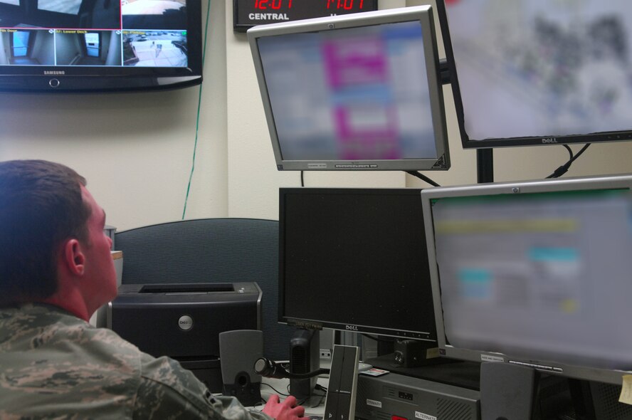 MINOT AIR FORCE BASE, N.D. -- Airman 1st Class Michael Bates, 5th Civil Engineer Squadron alarm room operator, monitors incoming calls and makes notifications during an exercise here Oct. 20. The base will be testing its mass notification systems next week, including the emergency notification system, recall procedures, the base information hotline and public information sites such as the base website, social media pages and local television and radio stations. The test will help determine the most efficient ways to reach the majority of the base and local populations. (U.S. Air Force photo by Laurie Arellano)