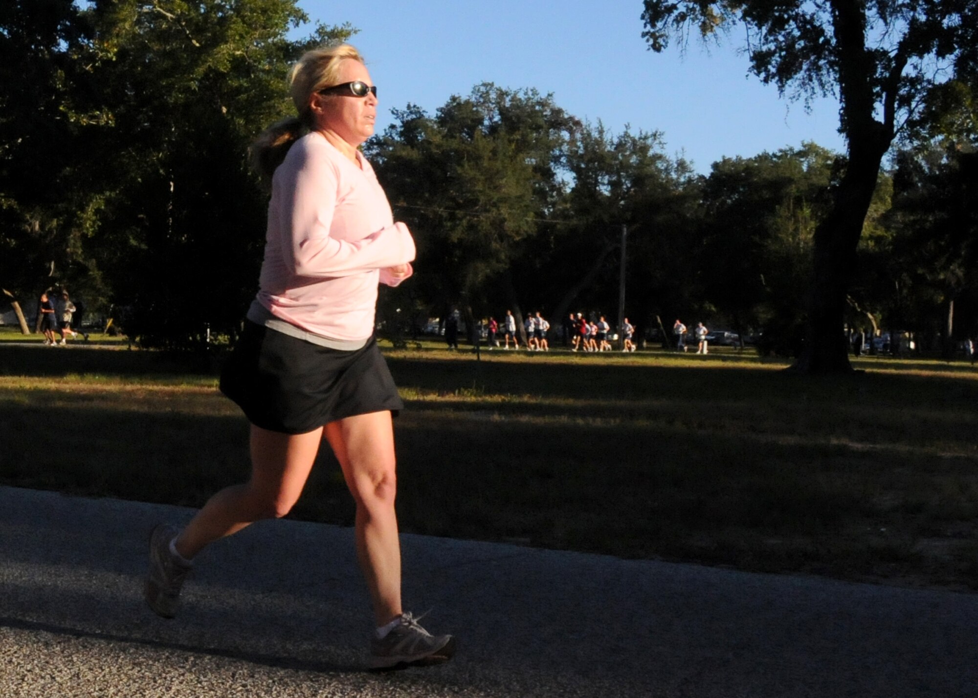 Staff Sgt.  Pamela Ives,  a 919th Special Operations Wing reservist, passes a checkpoint during the annual Breast Cancer Awareness 5K Run Oct. 15 at Eglin Air Force Base, Fla.  October is National Breast Cancer Awareness month and hundreds of civilians and military members joined together to complete the run.    (U.S. Air Force photo/Staff Sgt. Jonathan McCallum)   