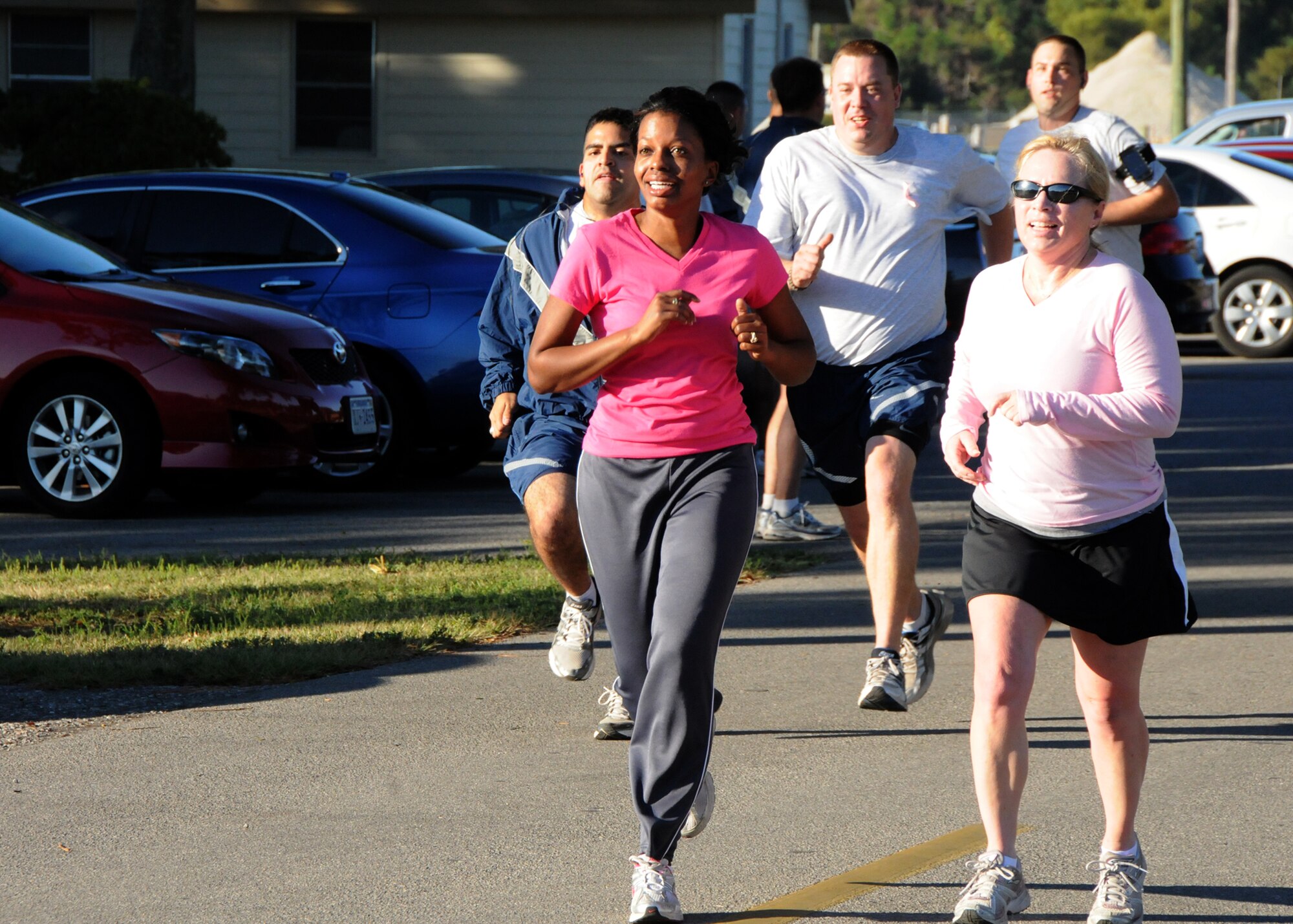 Second Lt. Latisha Davies, left, and Staff Sgt. Pamela Ives, both 919th Special Operations Wing reservists, approach the finish line of the third annual Breast Cancer Awareness 5K at Eglin Air Force Base, Fla., Oct. 15.  October is National Breast Cancer Awareness month, and hundreds of civilians and military members joined together to complete the run.   (U.S. Air Force photo/Staff Sgt. Jonathan McCallum)   