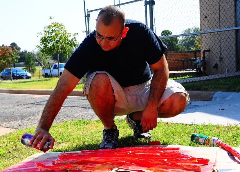 DYESS AIR FORCE BASE, Texas—Staff Sgt. Brandon Ramos, 7th Munitions Squadron, paints imitation intestines for a haunted house Oct. 20 at the Dyess Youth Center here. Airmen from 7th Munitions Squadron hold a haunted house each year. This year it will be held Oct. 22-23rd from 6 to 11 p.m. at the Youth Center. (U.S. Air Force photo/ Airman 1st Class Brittney Smolinski)