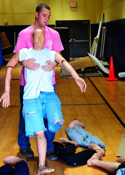 DYESS AIR FORCE BASE, Texas—Airman 1st Class Jonathan Fish, 7th Civil Engineer Squadron fire department, drags a dummy while setting up for a haunted house Oct. 20 at the Dyess Youth Center here. Airmen from 7th Munitions Squadron hold a haunted house each year. This year it will be held Oct. 22-23rd from 6 to 11 p.m. at the Youth Center. (U.S. Air Force photo/ Airman 1st Class Brittney Smolinski) 