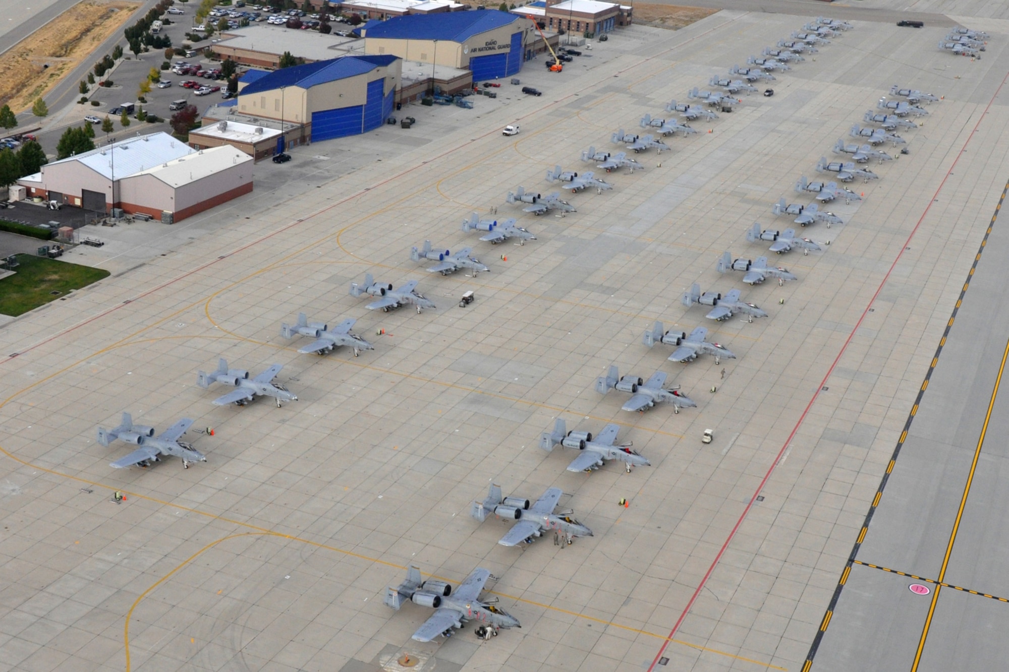 Forty A-10 Thunderbolt II jet aircraft sit idle on the ramp at Gowen Field in Boise, Idaho, on Oct. 15, 2010, after competing in Hawgsmoke 2010. Members of the 917th Wing and 47th Fighter Squadron at Barksdale Air Force Base, La., were in Boise supporting and competing in Hawgsmoke 2010, which is a biennial worldwide A-10 bombing, missile and tactical gunnery competition. The competition this year, which involved 40 jets and 72 pilots from 18 different units, was hosted by the 190th Fighter Squadron of the Idaho Air National Guard. (U.S. Air Force photo/Tech. Sgt. Jeff Walston) 