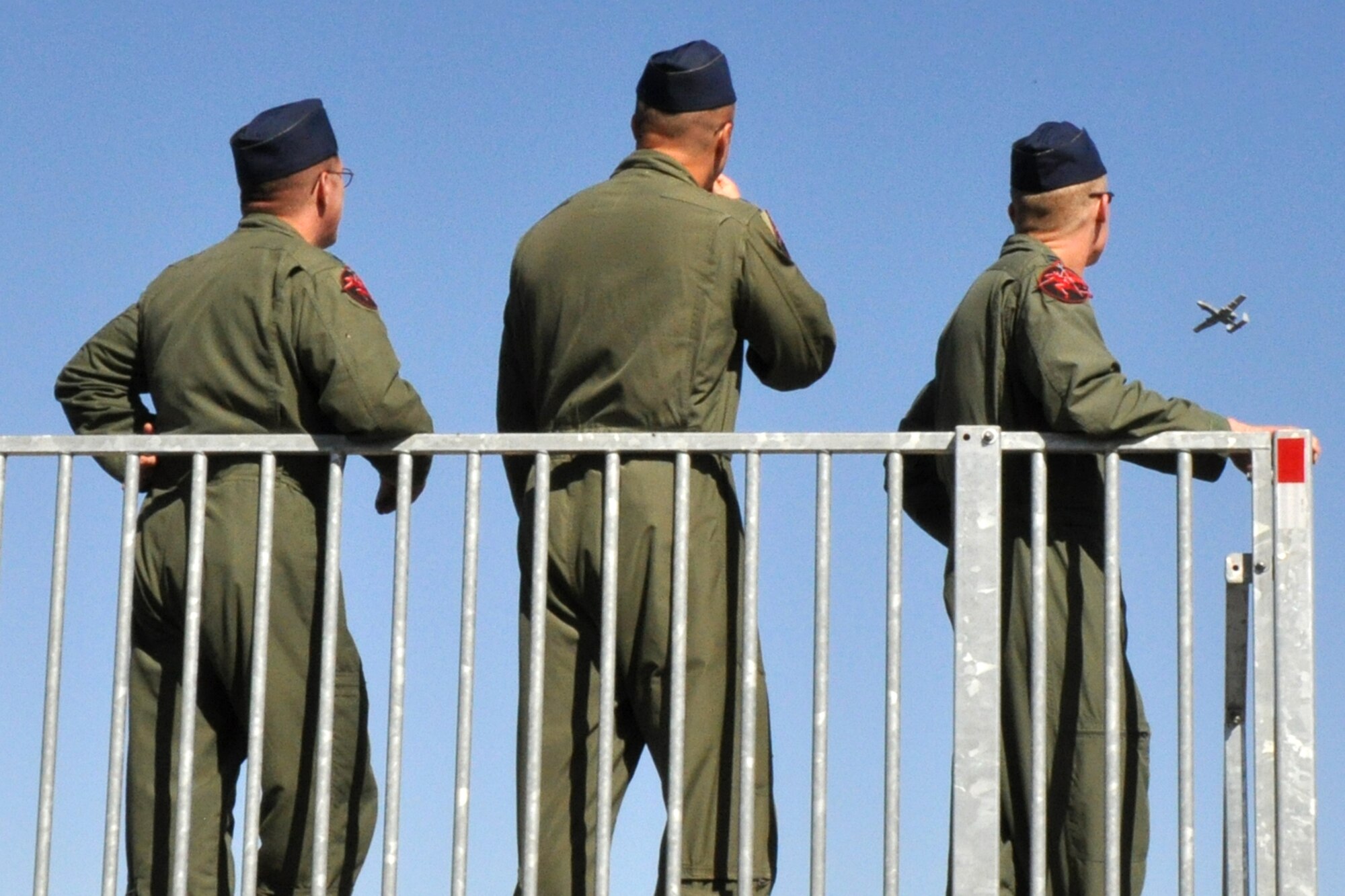 Lt. Col. Doug Champaign, (far left) commander of the 107th Fighter Squadron, and other members of the “Red Devils” from Selfridge Air National Guard Base, in Michigan, watch as their team competes in the Hawgsmoke 2010, Oct. 14, at the Saylor Creek Range in Idaho. The competition, which is a biennial worldwide A-10 bombing, missile and tactical gunnery competition, this year involved 40 jets and 72 pilots from 18 different units, and was hosted by the 190th Fighter Squadron of the 124th Fighter Wing, Idaho Air National Guard. (U.S. Air Force photo/Tech. Sgt. Jeff Walston)