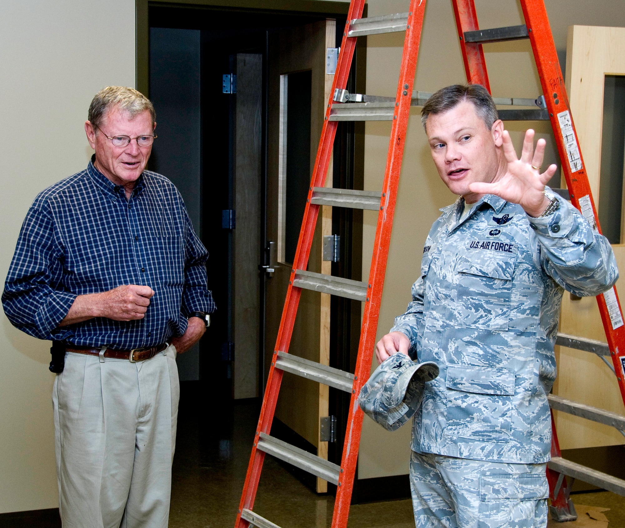 Col. Tim Gibson, 71st Mission Support Group commander, right, explains the virtual firing range at the new Armed Forces Reserve Center on Vance, to U.S. Senator James Inhofe from Oklahoma. The senator visited the base Oct. 14 and met with Airmen at the Collocated Club. (U.S. Air Force photo/ Terry Wasson)
