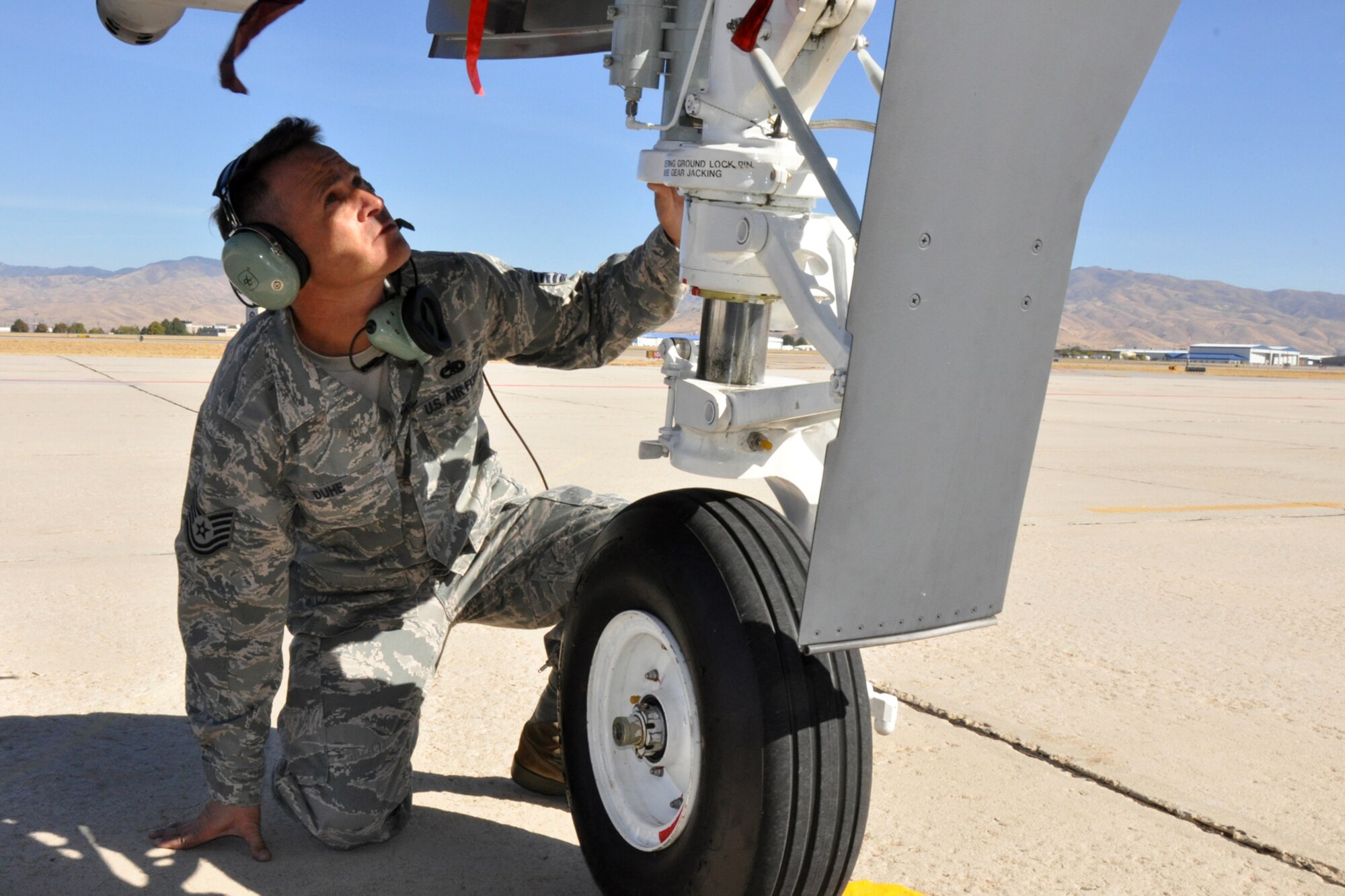 Technical Sgt. Chris Duhe, a crew chief with the 717th Aircraft Maintenance Squadron, performs a post-flight inspection of an A-10 Thunderbolt II on the ramp of Gowen Field in Boise, Idaho, Oct. 13, 2010. Sergeant Duhe is one of seven 917th Wing support personnel from Barksdale Air Force Base, La., who were in Boise supporting Hawgsmoke 2010, which is a biennial worldwide A-10 bombing, missile and tactical gunnery competition. The competition this year, which involved 40 A-10 Thunderbolt II jets and 72 pilots from 18 different units, was hosted by the 190th Fighter Squadron of the 124th Fighter Wing, Idaho Air National Guard. (U.S. Air Force photo/Tech. Sgt. Jeff Walston) 