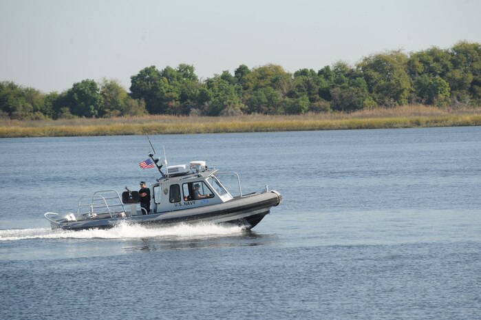 Master at Arms 1st Class Jacob Moore and Master at Arms 2nd Class Nicholas Green patrol the waters of the Cooper River Oct. 19, 2010, on Joint Base Charleston-Weapons Station, S.C. The merging of operations for the Navy and Air Force has combined some of the operating instructions for Sailors performing security on the Weapons Station, but their day-to-day mission has remained the same, providing security and patrol along the Cooper River and its tributaries. Both MA1 Moore and MA2 Green are security forces members with the 628th Security Forces Squadron. (U.S. Air Force photo/James M. Bowman)