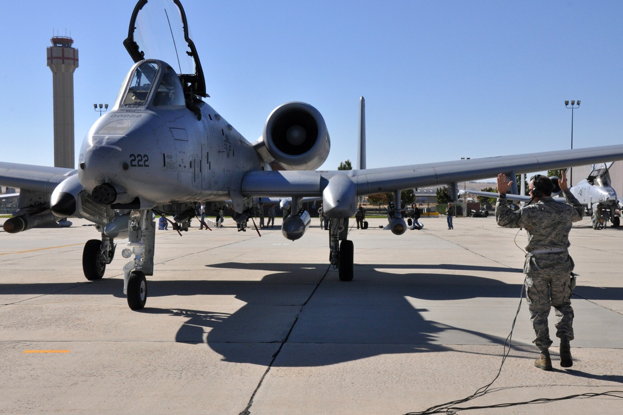 Technical Sgt. Kenneth Green, an A-10 aircraft mechanic with the 717th Aircraft Maintenance Squadron at Barksdale Air Force Base, La., marshals in an A-10 Thunderbolt II into place on the ramp of Gowen Field in Boise, Idaho, Oct. 13, 2010. Members of the 917th Wing and 47th Fighter Squadron at Barksdale Air Force Base, La., were in Boise supporting and competing in Hawgsmoke 2010, which is a biennial worldwide A-10 bombing, missile and tactical gunnery competition. The competition this year, which involved 40 jets and 72 pilots from 18 different units, was hosted by the 190th Fighter Squadron of the 124th FW. (U.S. Air Force photo/Tech. Sgt. Jeff Walston) 


