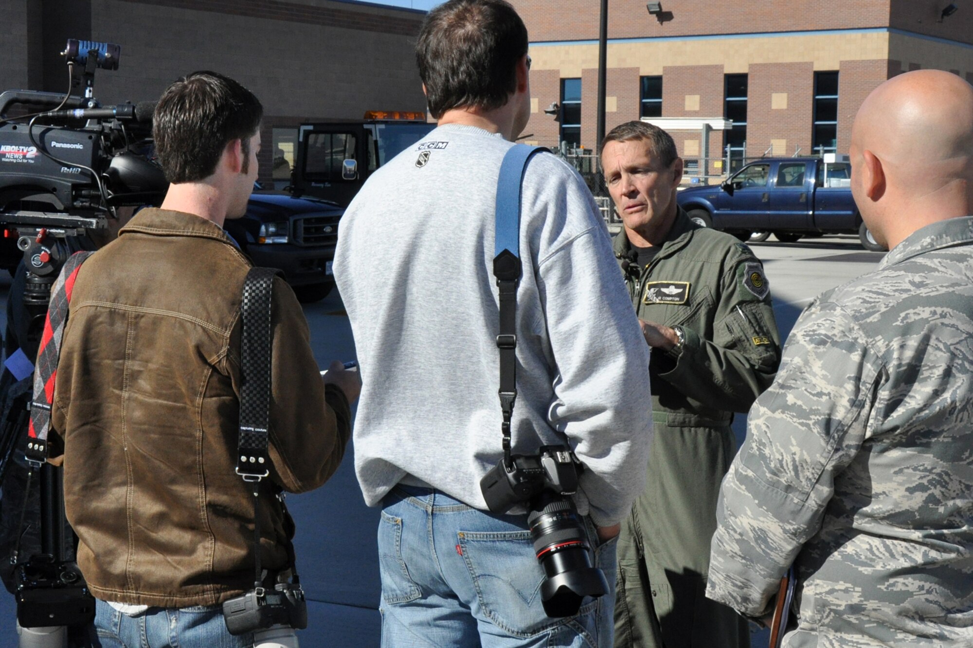 Col. James R. Compton, commander of the 124th Fighter Wing for the Idaho Air National Guard, Boise, Idaho, fields questions from local and national media on the ramp at Gowen Field in Boise, Oct. 13, 2010. Members of the 917th Wing and 47th Fighter Squadron at Barksdale Air Force Base, La., were in Boise supporting and competing in Hawgsmoke 2010, which is a biennial worldwide A-10 bombing, missile and tactical gunnery competition. The competition this year, which involved 40 jets and 72 pilots from 18 different units, was hosted by the 190th Fighter Squadron of the 124th FW. (U.S. Air Force photo/Tech. Sgt. Jeff Walston) 