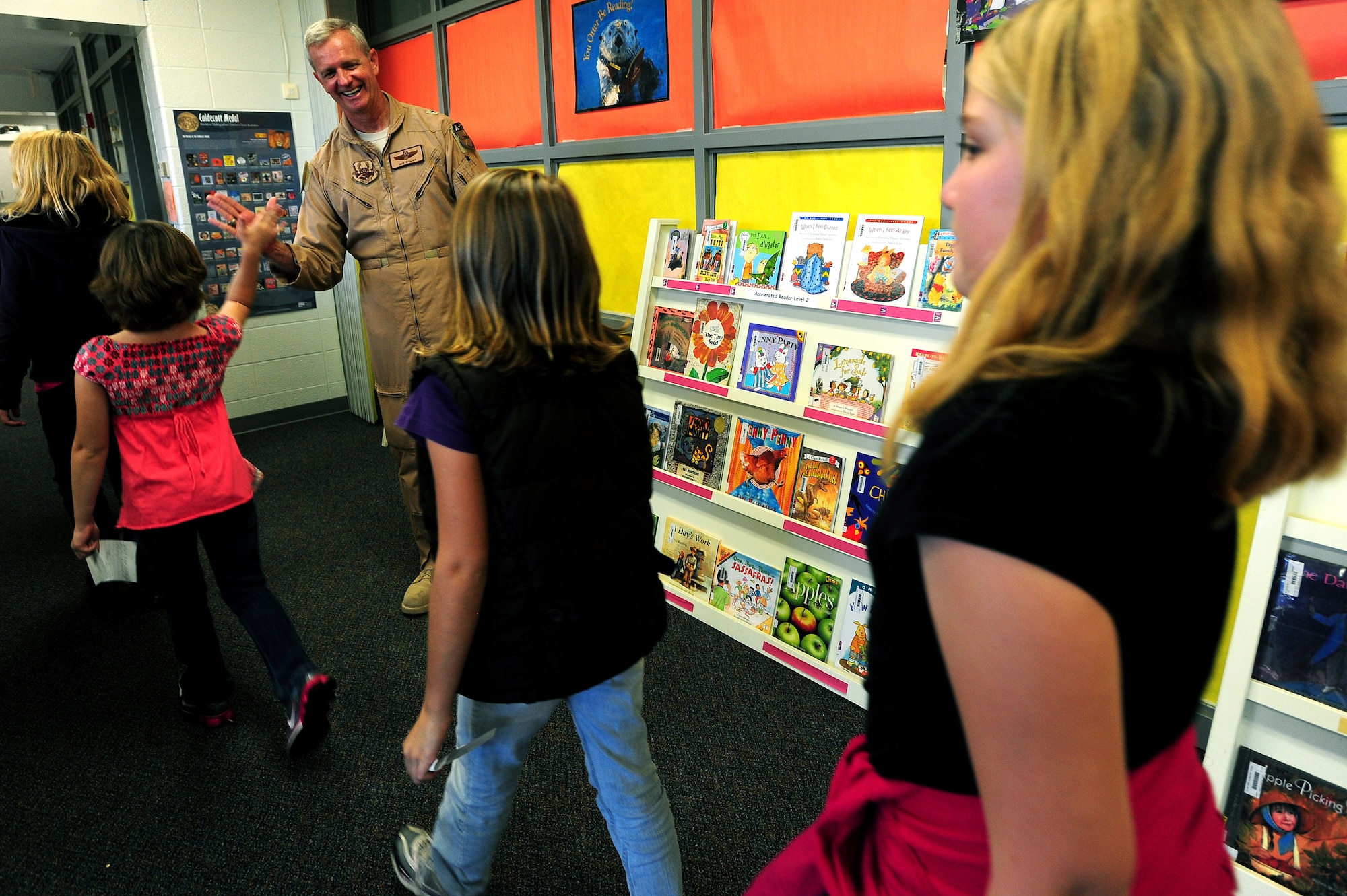 Air Force Brig. Gen. Guy Walsh high-fives students from Clark Wood Elementary School in Elkland, Pa., during a visit to the school, Oct. 7, 2010. Walsh, commander of the 451st Expeditionary Wing while deployed to Khandhar, Afghanistan, corresponded with third and fourth graders at the school during his year-long deployment. (U.S. Army photo by Sgt. 1st Class Jon Soucy)(Released)
