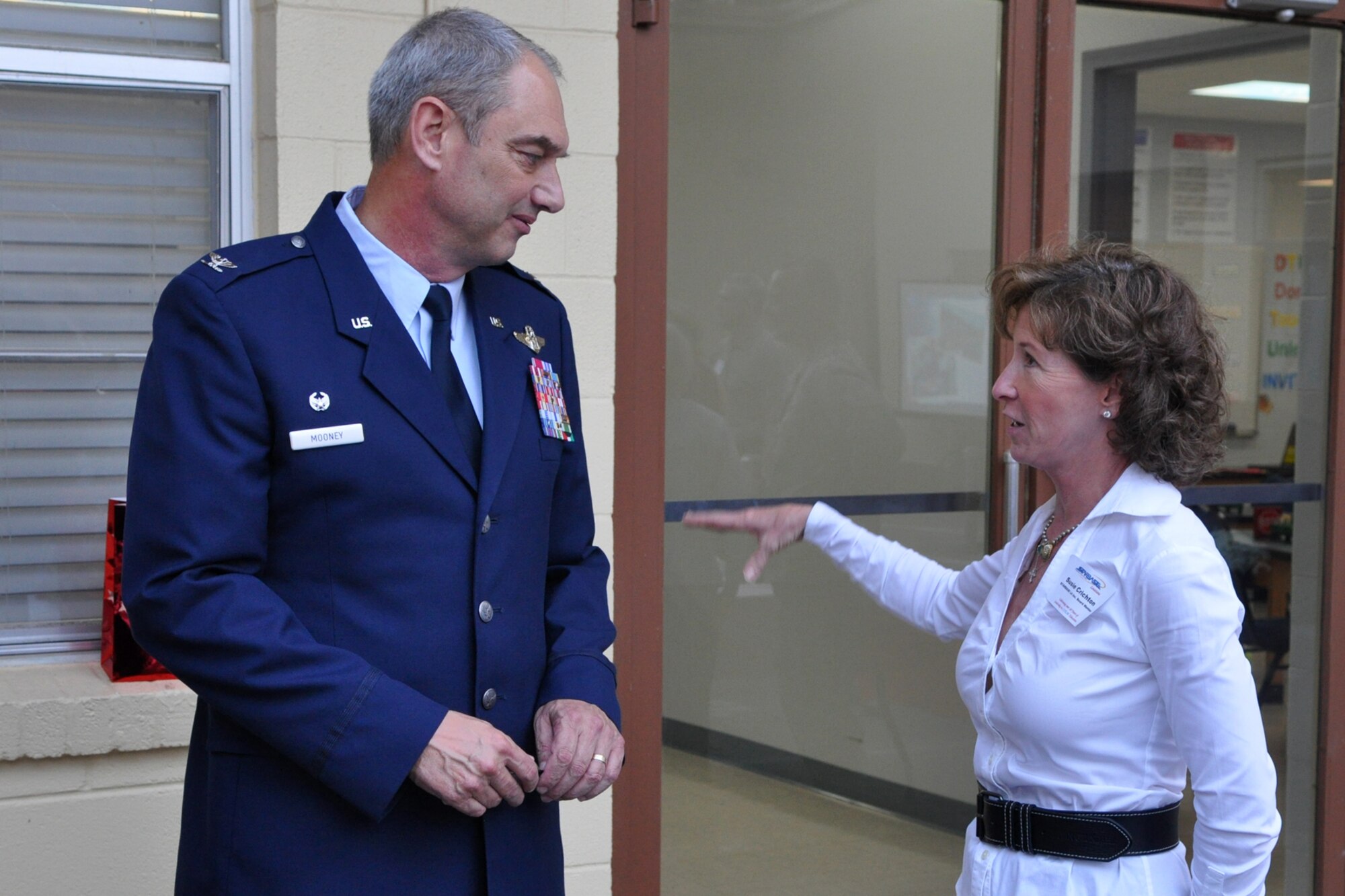 Col. John J. Mooney III, commander of the 917th Wing, discuses the future of education with Susie Crichton, STARBASE board member, during the grand re-opening celebration at the newly remodeled STARBASE facility on Barksdale Air Force Base, La., Oct. 18, 2010. The 917th Wing at Barksdale AFB, which is a sponsor of the STARBASE program, supplied the lab with 32 refurbished computers for the students use.  (U.S. Air Force photo/Tech. Sgt. Jeff Walston)