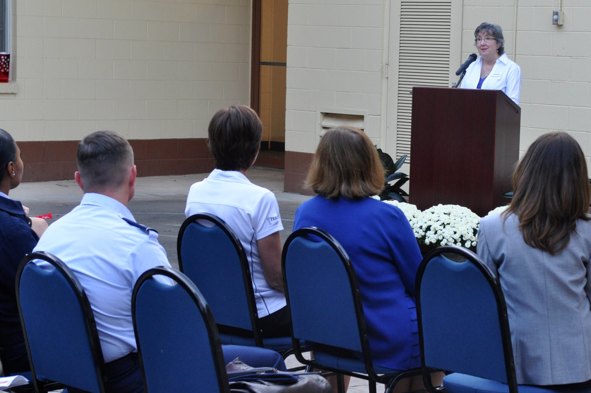 Sheila Schencke, a former STARBASE executive director, speaks to a crowd attending the grand re-opening celebration at the newly remodeled STARBASE facility on Barksdale Air Force Base, La., Oct. 18, 2010. Approximately 75 people toured the facility and were treated to experiments conducted by some of the students. (U.S. Air Force photo/Tech. Sgt. Jeff Walston)