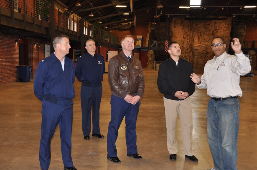 From left Cols. Brett Newman, Mike Ochs, Ron Wilt and Capt. Kevin Hempel get a tour of the new Boy Scout Base Camp building from Jonathan Jones, Base Camp program director.(Air Force Photo/Paul Zadach)
