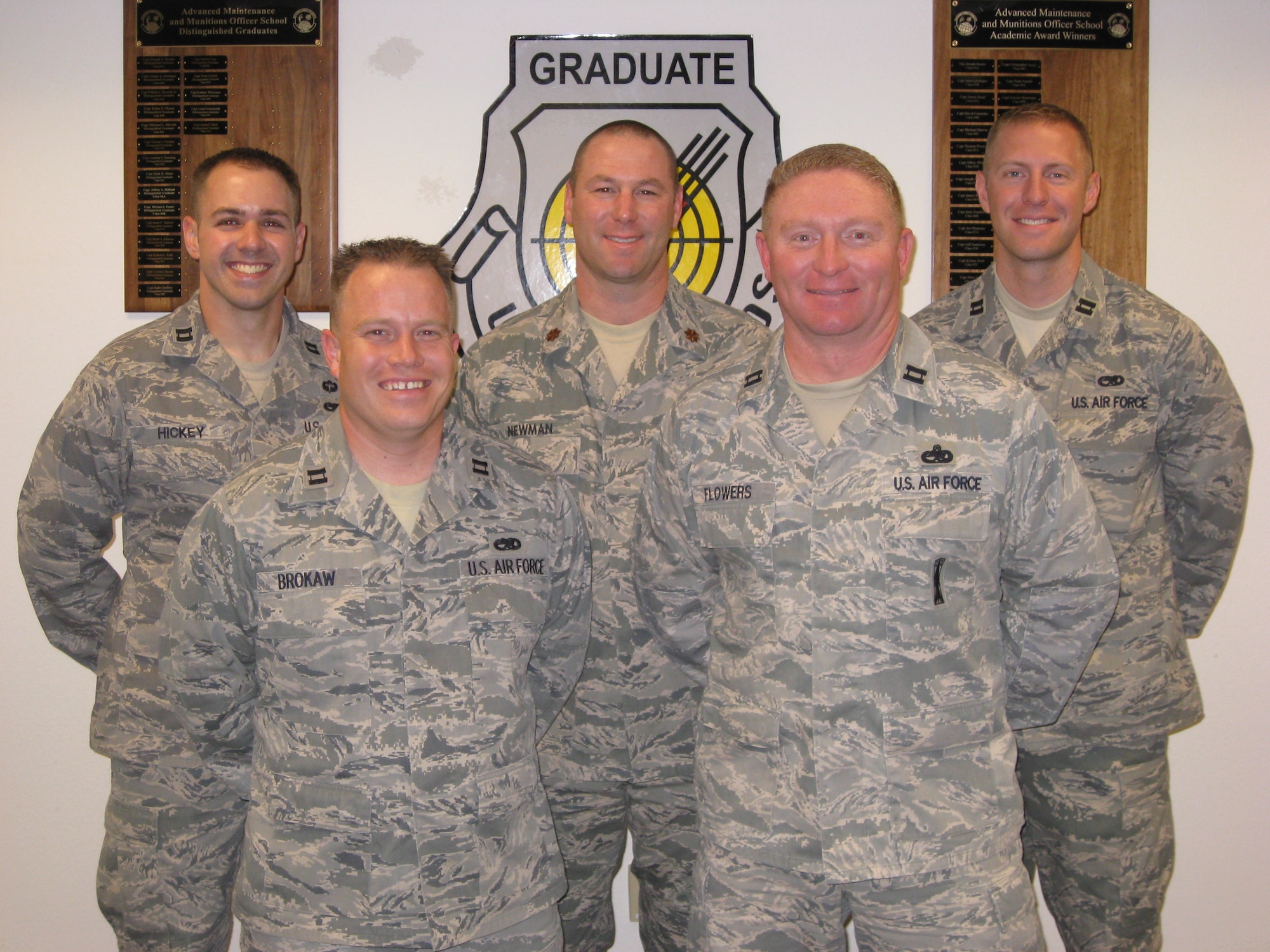 NELLIS AIR BASE FORCE, Nev. -- The U.S. Air Force Advanced Maintenance and Munitions Officer School Class 10B poses for a group photo prior to their graduation ceremony Oct. 15. The U.S. Air Force AMMOS was developed as a result of a need for mid-level logistics officers to have enhanced logistics knowledge similar to what operators receive from the United States Air Force Weapons School.
