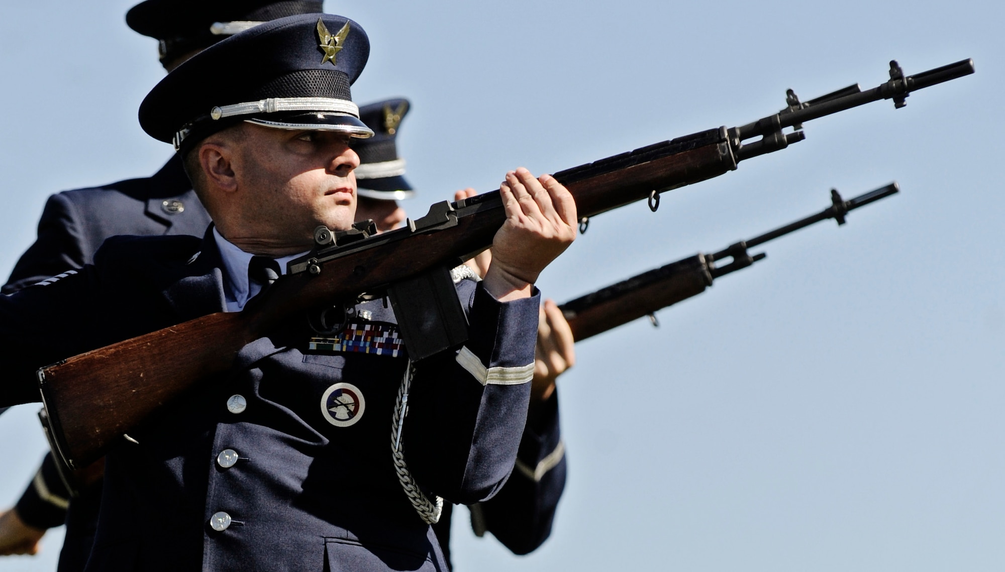 JEFFERSON BARRACKS, MO – The Honor Guard firing party fires the first volley of shots during a funeral ceremony at the Jefferson Barracks National Cemetery Oct. 15. The Scott Air Force Base Honor Guard performs numerous details for Air Force veterans at this cemetery as well as covering funerals throughout a four state region. Airmen of all ranks and units are assigned to the Honor Guard for four months at a time. (U.S. Air Force photo/ Staff Sgt. Ryan Crane)