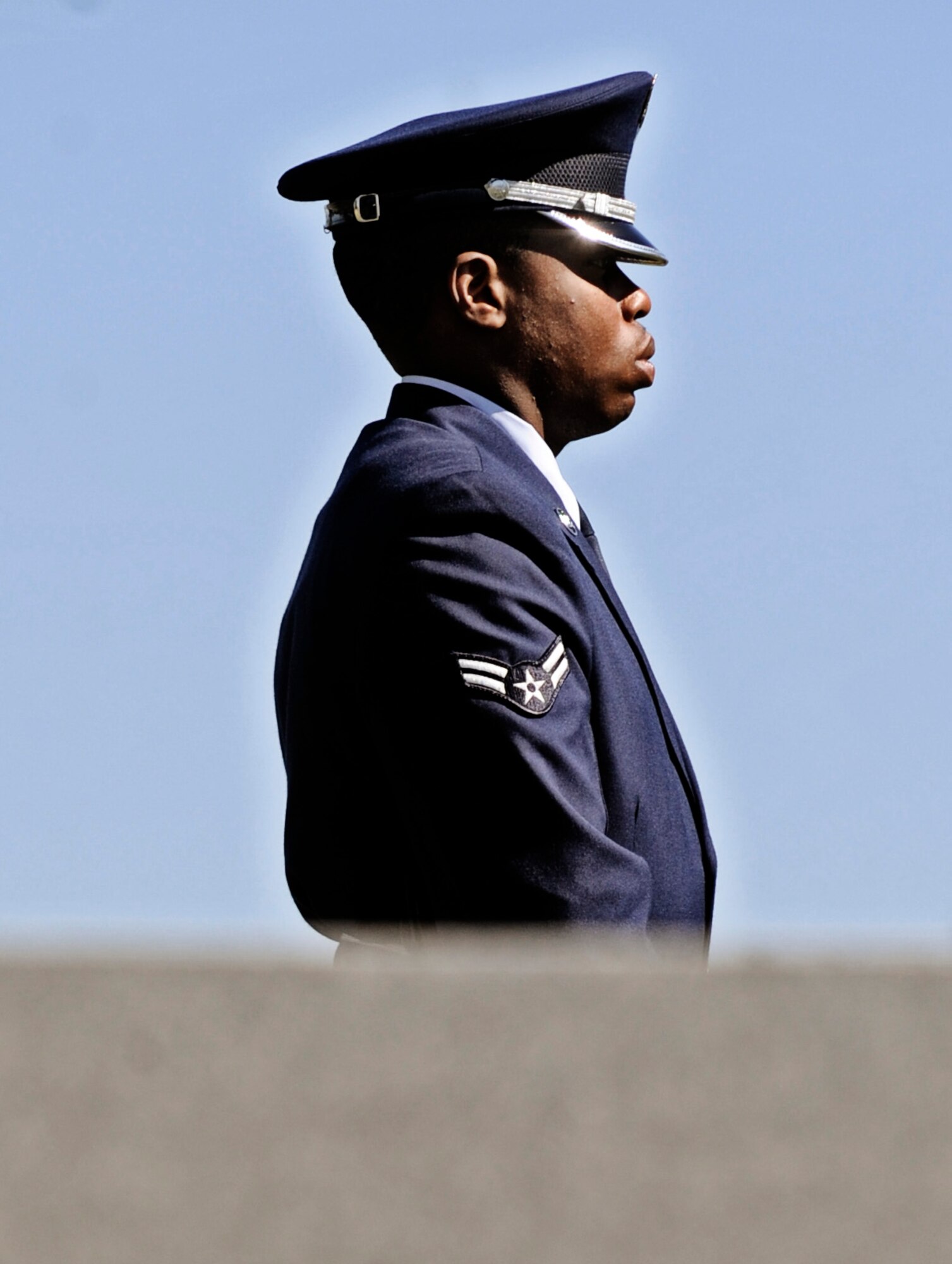 JEFFERSON BARRACKS, MO – Airman 1st Class Bryant Brown, Airman in charge of the firing party, stands guard as the detail approaches their rifles at the Jefferson Barracks National Cemetery Oct. 15. The Scott Air Force Base Honor Guard performs numerous details for Air Force veterans at this cemetery as well as covering funerals throughout a four state region. Airmen of all ranks and units are assigned to the Honor Guard for four months at a time. (U.S. Air Force photo/ Staff Sgt. Ryan Crane)