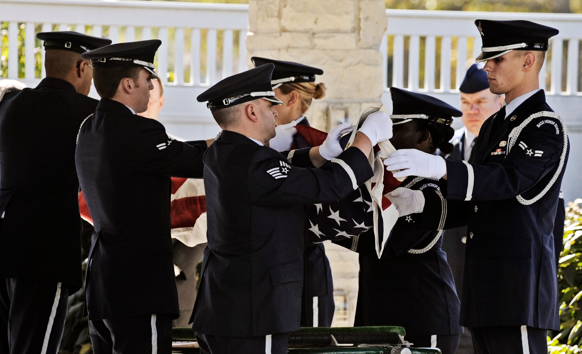 JEFFERSON BARRACKS, MO – An Honor Guard detail ceremoniously folds a flag to be draped over an urn at the Jefferson Barracks National Cemetery Oct. 15. The Scott Air Force Base Honor Guard performs numerous details for Air Force veterans at this cemetery as well as covering funerals throughout a four state region. Airmen of all ranks and units are assigned to the Honor Guard for four months at a time. (U.S. Air Force photo/ Staff Sgt. Ryan Crane)