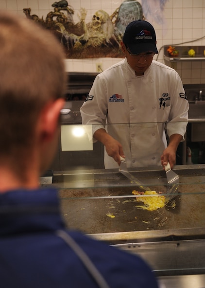 DYESS AIR FORCE BASE, Texas --Airman 1st Class Michael Hernandez, 7th Force Support Squadron services specialist, fries eggs for an Airman at the Longhorn Dining Facility here Oct. 20. The mission of the 7 FSS is to develop, sustain and regenerate people through first-class customer service, the first time and every time. For the dining facility hours of operation, logon to http://www.dyessfss.com/Food_Service.html or call (325) 696-2421. (U.S. Air Force photo/ Senior Airman Felicia Juenke)