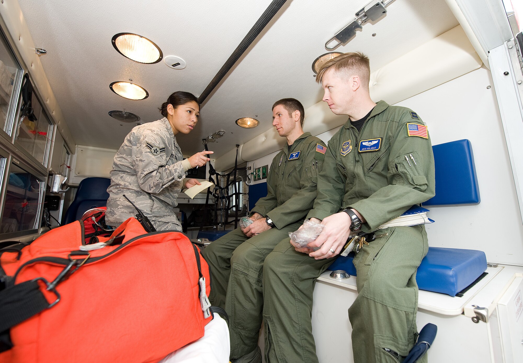 Airman 1st Class Rossmery Holyfield, 436th Medical Operations Squadron,
triages 1st Lt. Matt Onxley, 3rd Airlift Squadron, and Capt. Josh Holaday,
3rd AS, during an exercise Oct. 14, 2010. The medical and fire first
responders had to treat the crew of the aircraft for exposure to leaked
radioactive materials as part of the exercise. (U.S. Air Force photo by
Jason Minto/Released)
