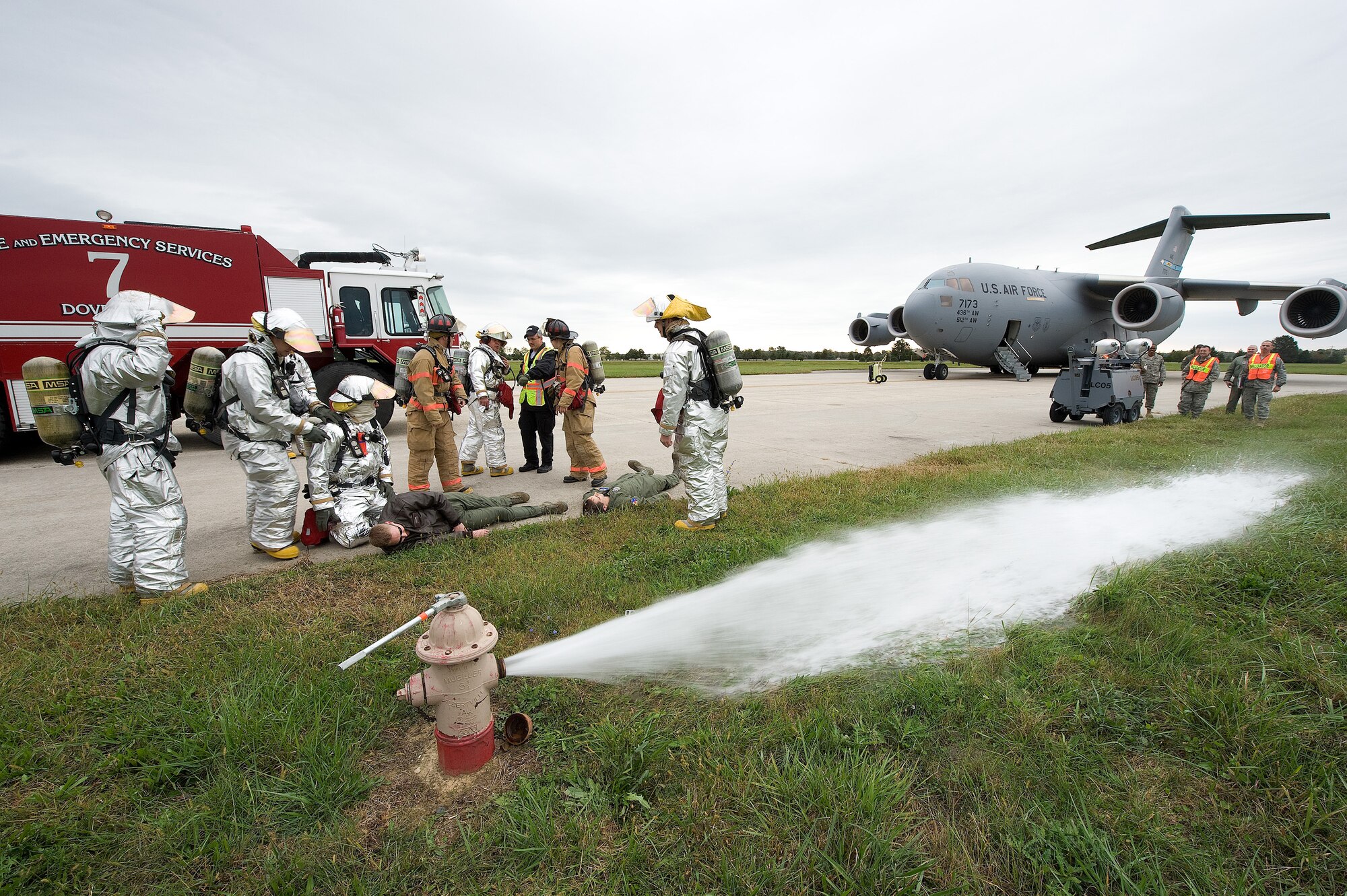 Members of the 436th Civil Engineers Squadron simulate decontamination
procedures for members of the 3rd Airlift Squadron during an exercise Oct.
14, 2010, on Dover Air Force Base, Del. The exercise focused on the response
to leaked radioactive materials after a hard landing. (U.S. Air Force photo
by Jason Minto/Released)
