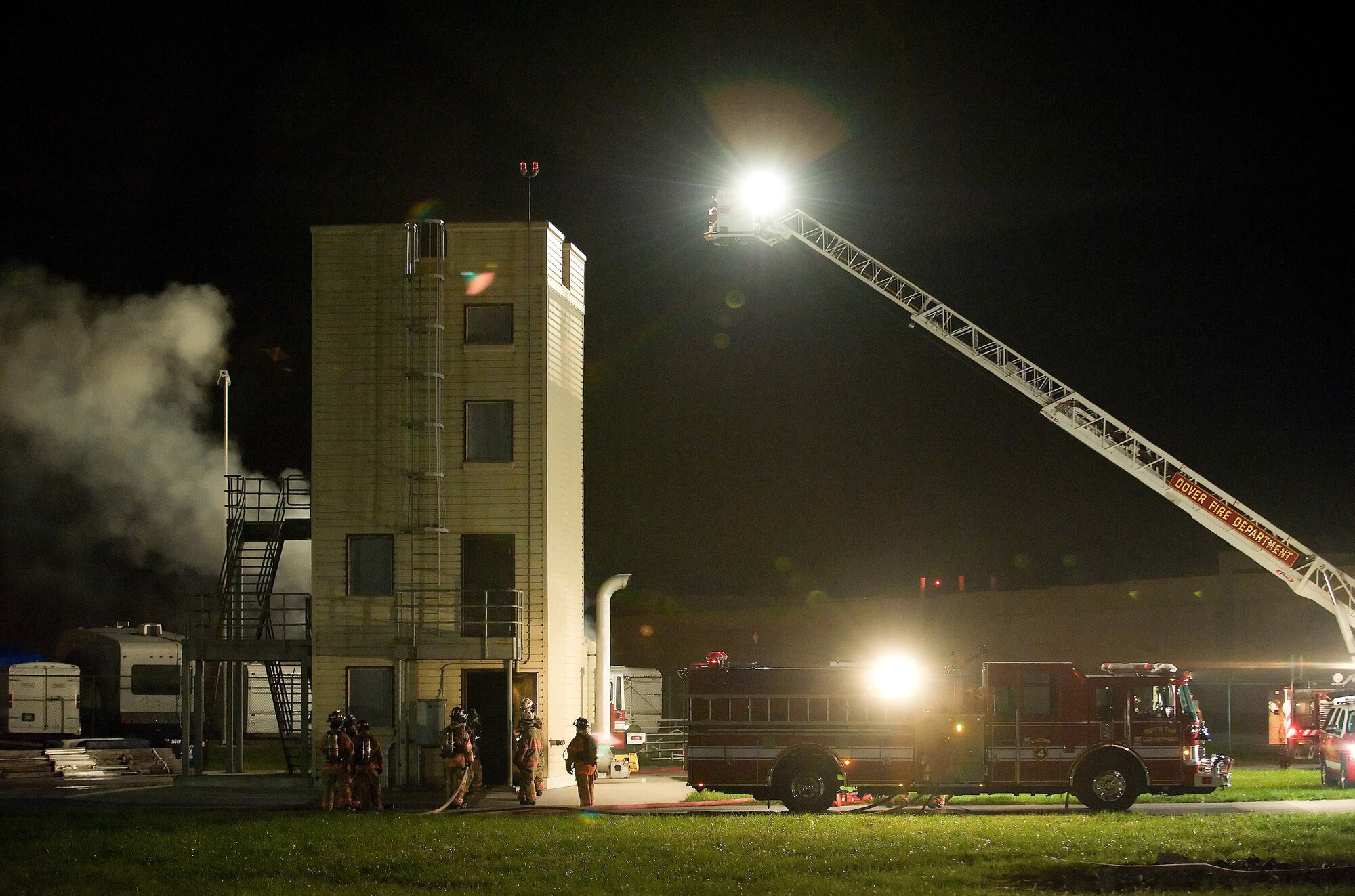Dover Air Force Base and City of Dover firefighters prepare for a live
fire exercise Oct. 19, 2010, at the fire training area on Dover AFB. The
exercise is one of several semi-annual training exercises done at Dover AFB
this year. (U.S. Air Force photo by Jason Minto/Released)