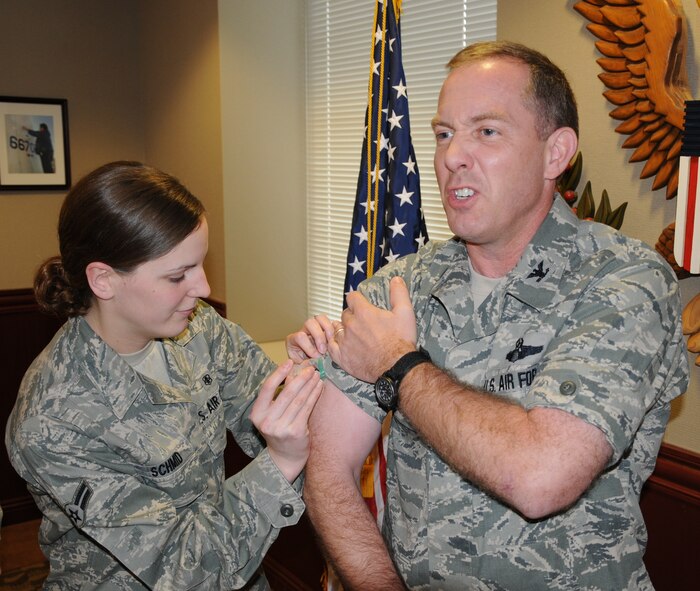 LAUGHLIN AIR FORCE BASE, Texas – Airman 1st Class Jaala Schmid, 47th Medical Operations Squadron, administers a flu shot to Col. Michael Frankel, 47th Flying Training Wing commander, recently. Flu vaccines are available to active duty military members at Laughlin’s Anderson Hall Thursday, Oct. 21 and Friday, Oct. 22 from 7:30 a.m. until 2 p.m. (U.S. Air Force photo by Airman 1st Class Blake Mize)