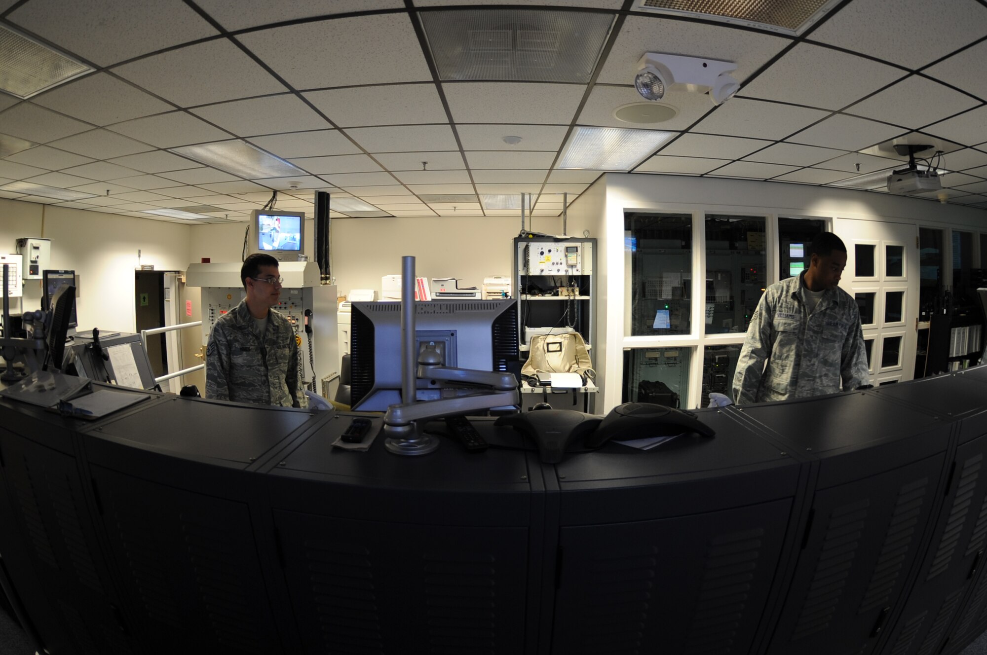 WHITEMAN AIR FORCE BASE, Mo. - 509th Bomb Wing Command Post Airmen, Staff Sgt. Nicholas Himes, senior enlisted emergency action controller, and Staff Sgt. Lavell Williams, NCO in charge of training, man the main console, Oct. 6. Whiteman's Command Post was named Best Large Command Post in the Air Force for 2010. (U.S. Air Force photo by Senior Airman Carlin Leslie)
