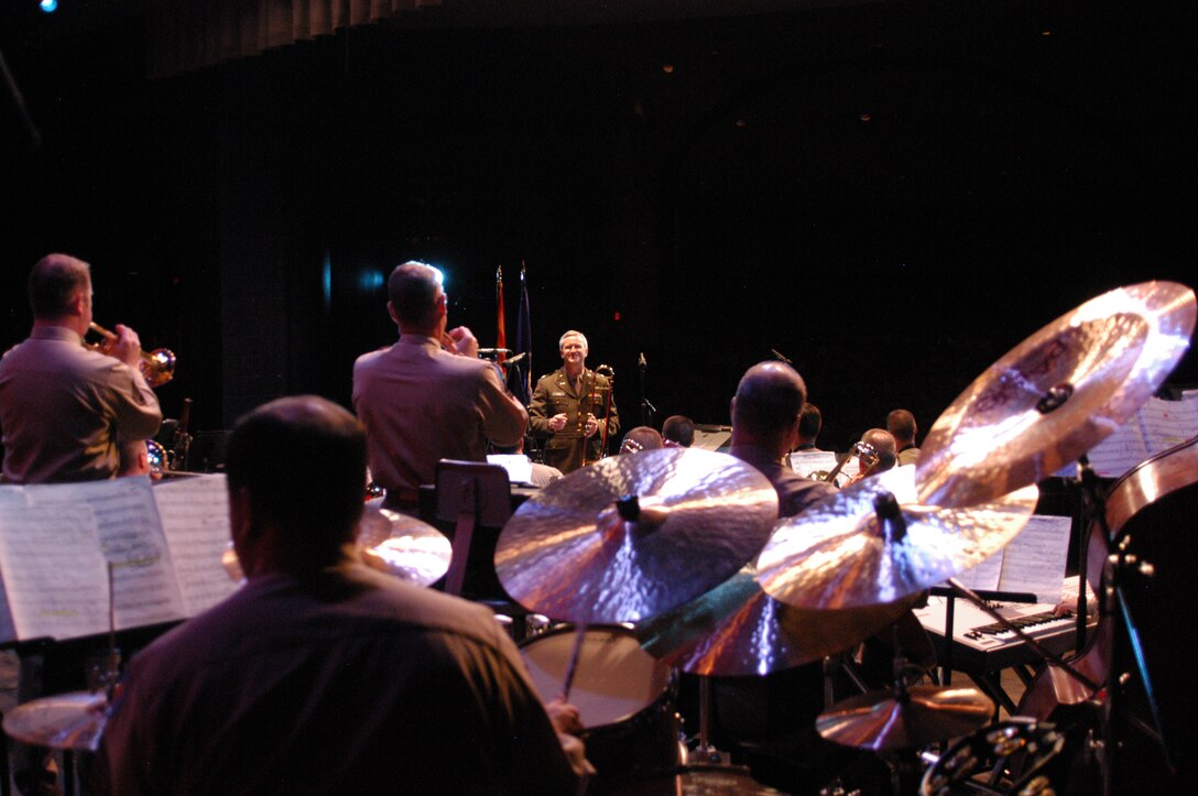 Lt Col Larry H. Lang, Commander and Conductor of the USAF Academy Band, plays the role of Major Glenn Miller in a rousing patriotic tribute to the Big Band Era with the Falconaires Jazz Band.