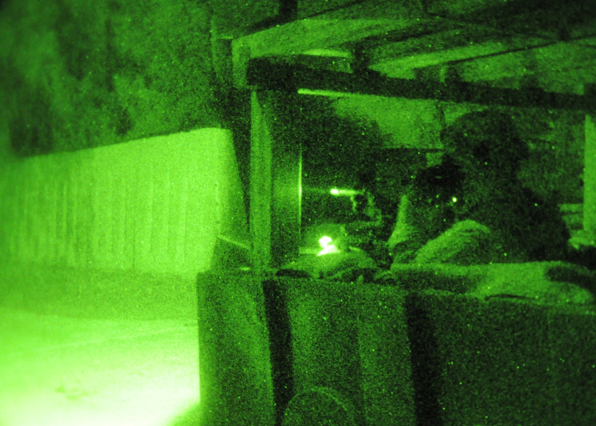 An Airman from the 644th Combat Communications Squadron scans the perimeter for opposing forces during a field training exercise of the Combat Readiness School at Andersen Air Force Base, Guam, Oct. 18. Andersen Airmen teamed up with members of the 1 Combat Communications Squadron, Royal Australian Air Force Base, Sydney, for a 20-day combat-skills training course to teach the Airmen new tactics and act as a refresher course for those who were already familiar with the combat training. (U.S. Air Force photo/ Senior Airman Nichelle Anderson)