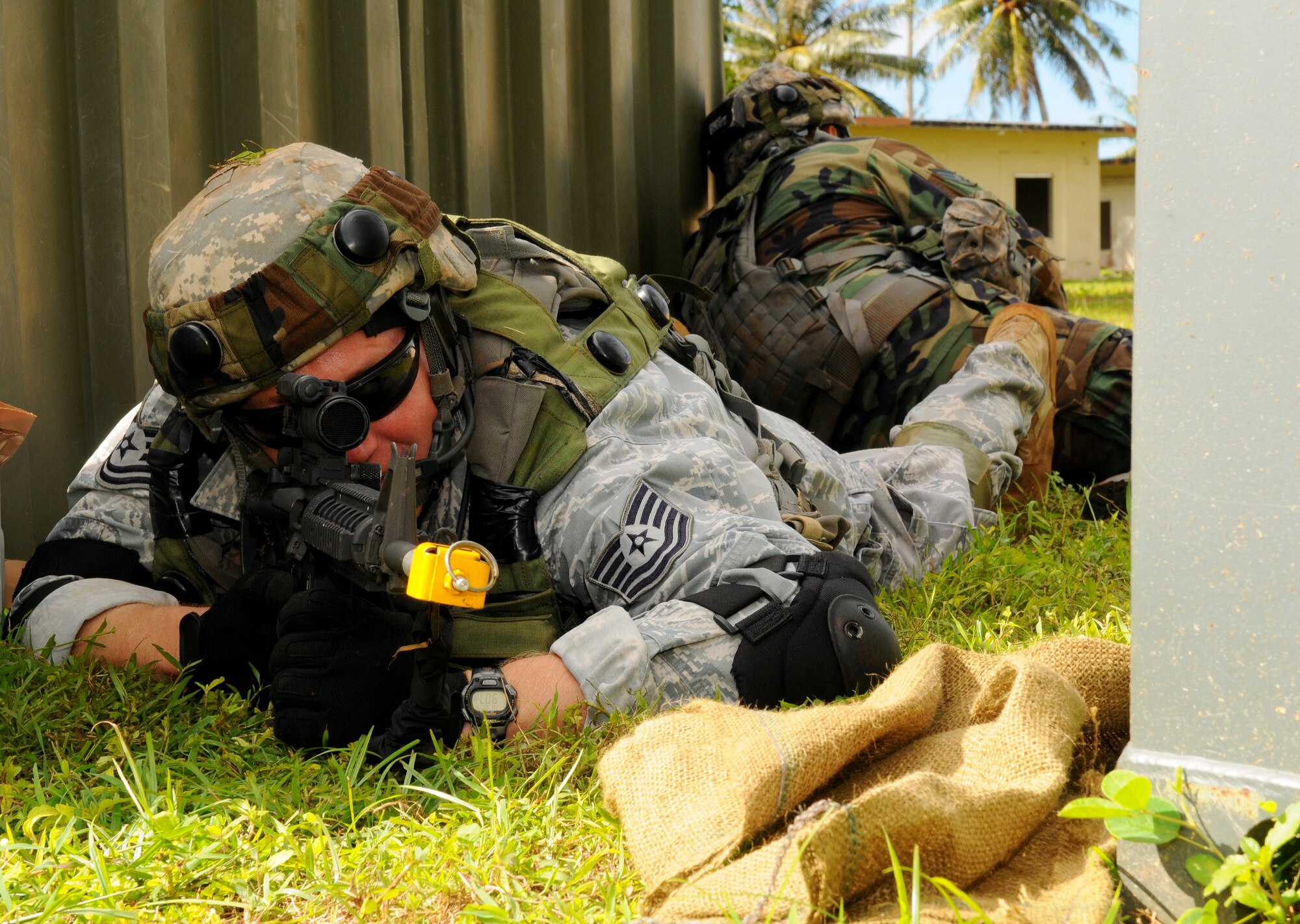 Tech. Sgt. Curtis Nissen, 644th Combat Communication Squadron, quality assurance scans the perimeter in a defensive fighting position during the field training exercise portion of Combat Readiness School at Andersen Air Force Base, Guam Oct. 19. (U.S. Air Force photo/ Senior Airman Nichelle Anderson)