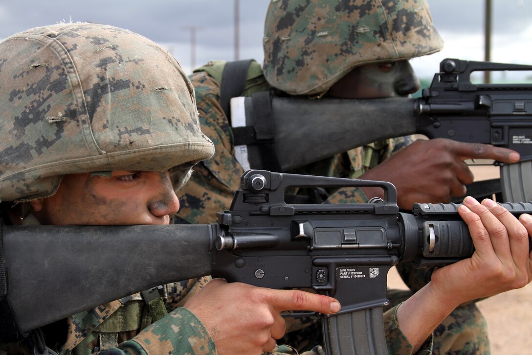Recruits Bernard Garcia (front) and Emerson Dorsey sight in their rifles, while providing external security during the Crucible. The Crucible is a 54-hour training event conducted during Marine Corps Recruit Training at Edson Range, Marine Corps Base Camp Pendleton, Calif. The Crucible requires Marine recruits to overcome mentally and physically-demanding obstacles as a team. Garcia and Dorsey are members of Platoon 1085, Company D.