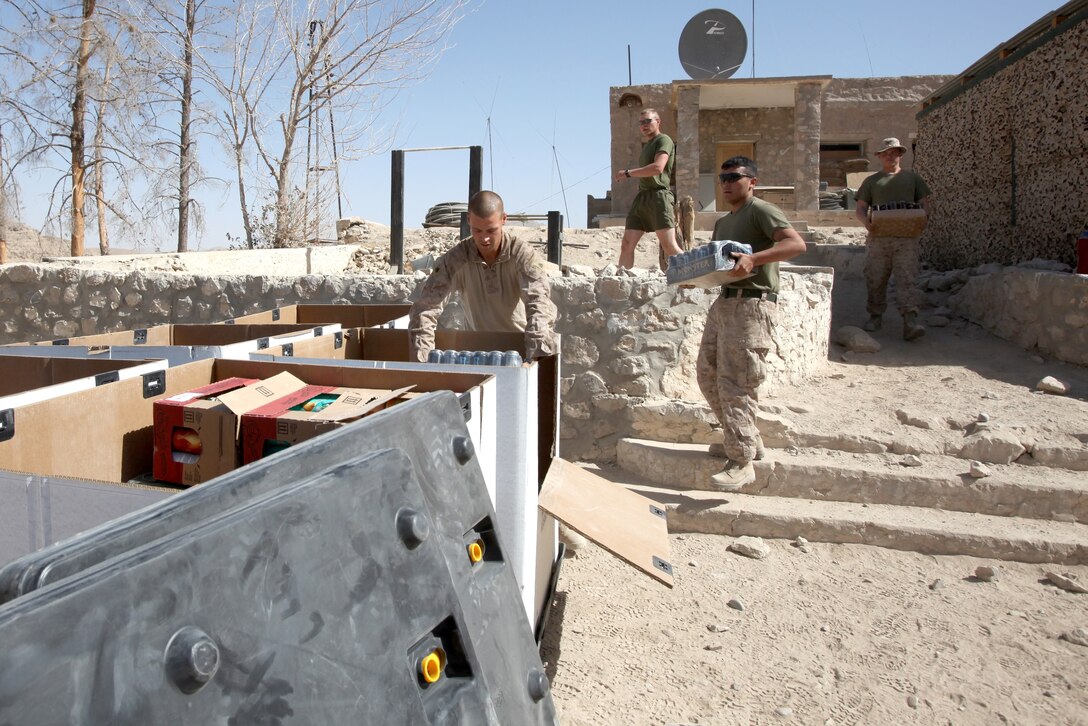 Marine Corps Community Service Marines with Headquarters and Service Company, 1st Marine Logistics Group (Forward) pack up the mobile post exchange in order to move it to Observation Post Athens aboard Forward Operating Base Zeebrugge, Kajaki, Afghanistan, Oct. 20. The mobile PX travels around to different forward operating bases in Helmand province to sell hygiene items, supplements and various different snacks to help boost morale.