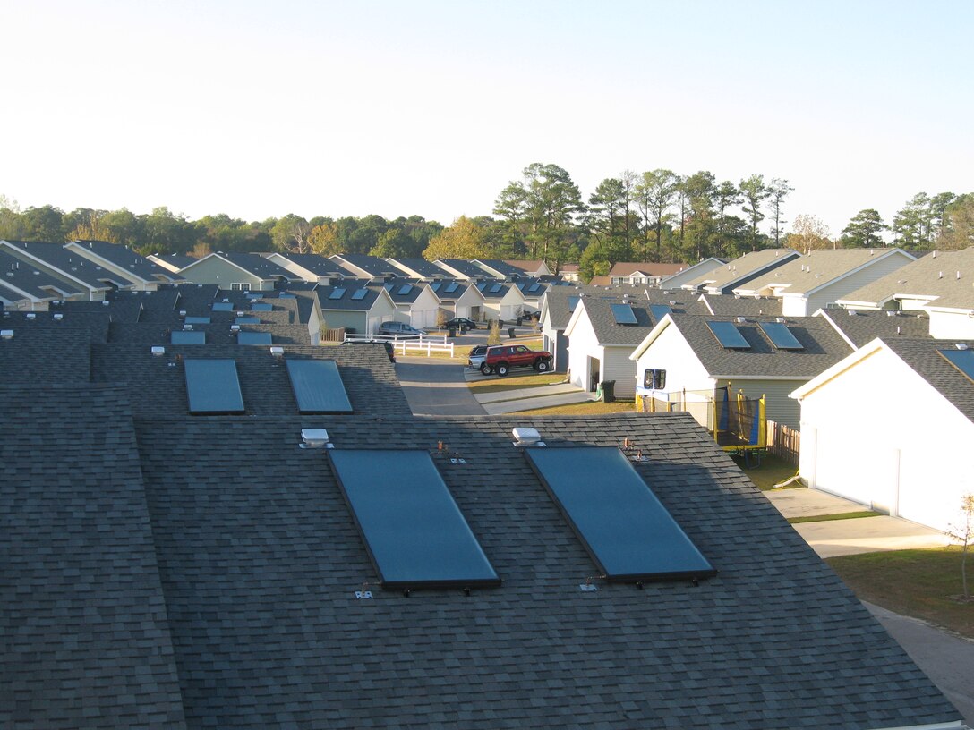 Military housing units aboard Marine Corps Base Camp Lejeune are currently being equipped with solar hot-water heaters. Approximately 2,200 homes aboard the base and surrounding installations will receive this upgrade which helps cut down overall electricity and hot-water costs.::r::::n::(courtesy photo by: Dale Freudenberger, FLS Energy)::r::::n::