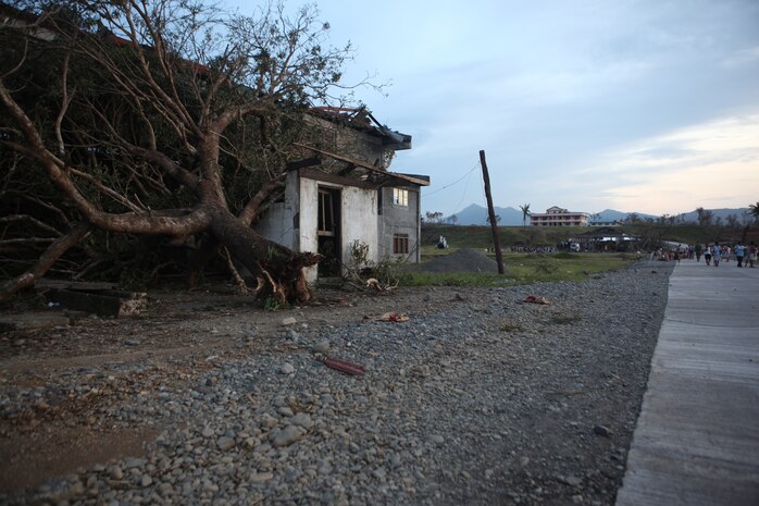 A building in the town of Divillikan, a province of Isabella, in the Republic of the Philippines, lies damaged from the Super Typhoon Juan. Members of the 31st Marine Expeditionary Unit conduct initial bilateral recovery efforts in Isabela Province, Republic of the Philippines Oct. 21. The Philippine government requested assistance from the 31st MEU after Super Typhoon Juan caused damage throughout the area. According to the Philippine National Disaster Risk Reduction and Management Council, the storm has thus far left 19 dead and 24 injured, along with more than 11,000 people displaced and more than 330,000 people affected. The 31st MEU is positioned close to Northern Luzon to be available for assistance as needed.