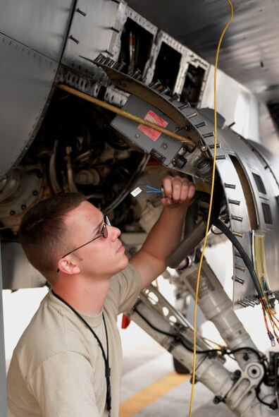 Senior Airman Bradley Baldus, 51st Aircraft Maintenance Squadron, troubleshoots an electrical system problem in an Osan F-16 Fighting Falcon Oct. 20 during exercise Max Thunder 10-2 at Kwangju Air Base, Republic of Korea. (U.S. Air Force photo/Staff Sgt. Eric Burks)